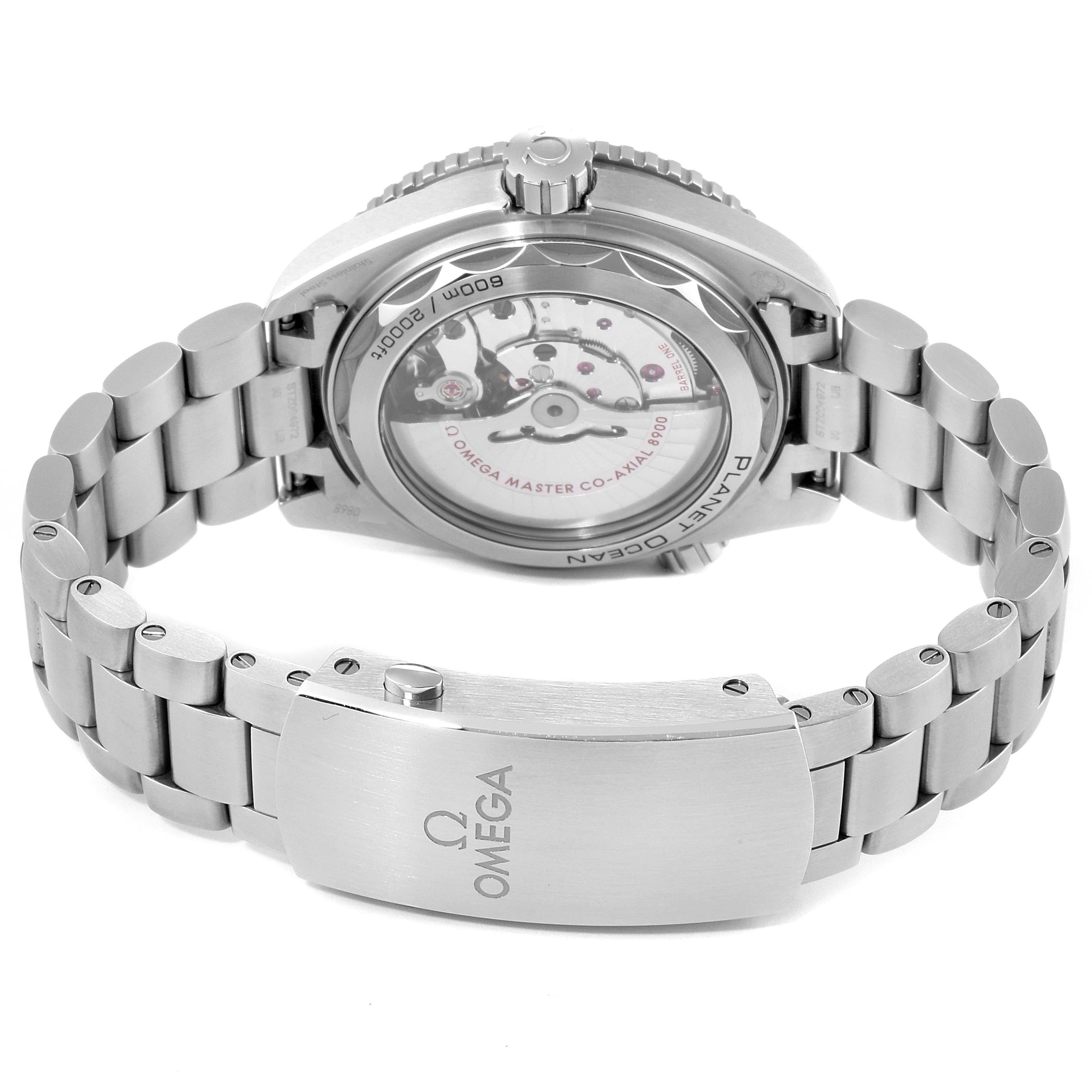 The image shows the back view of an Omega Planet Ocean 215.30.44.21.04.001 Men
s Stainless Steel White Dial 215.30.44.21.04.001 Men
s Stainless Steel White Dial watch, displaying its movement and stainless steel bracelet with the clasp.