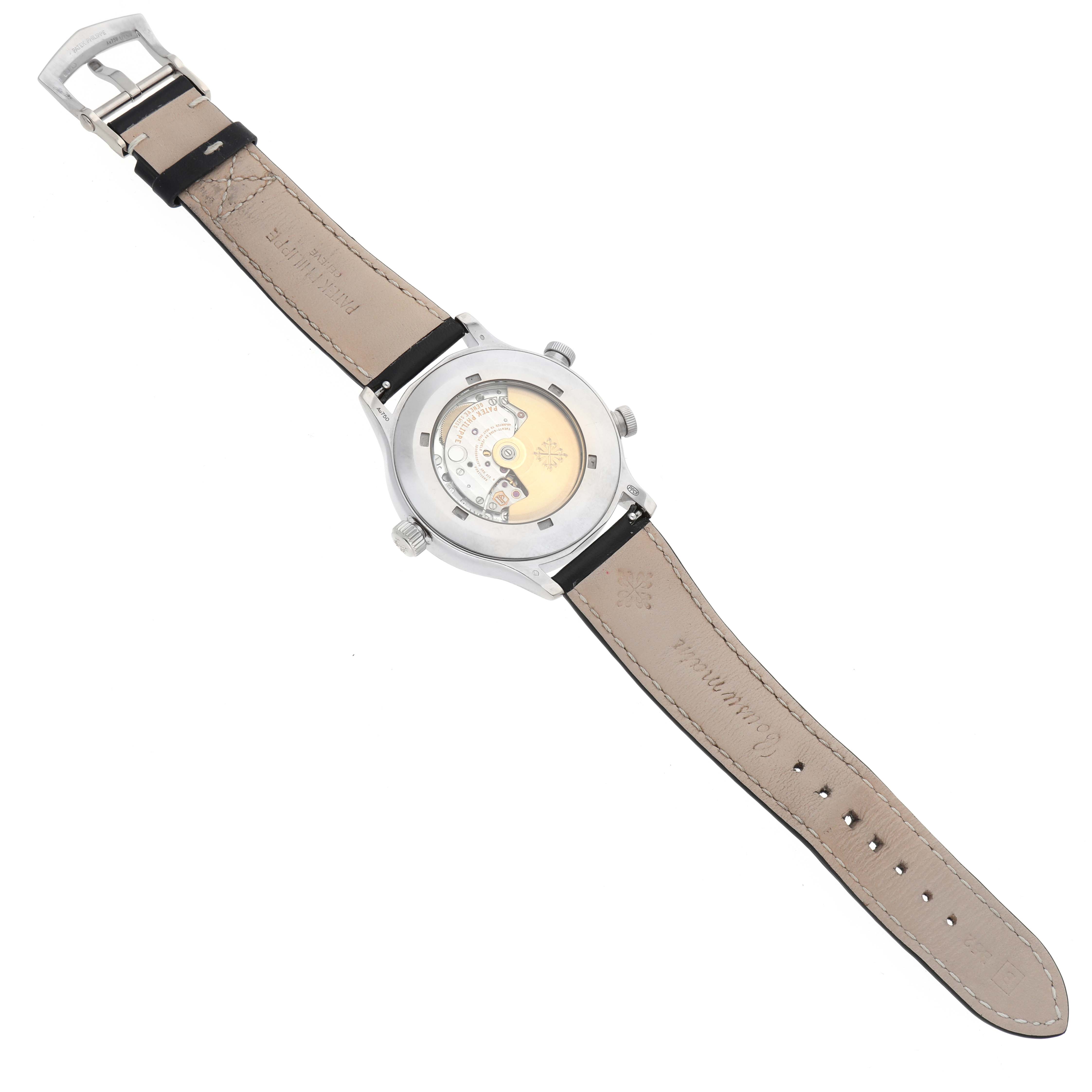 The image shows the back view of a Patek Philippe Calatrava 5524G Men's White Gold Blue Dial watch, displaying its mechanical movement and leather strap.