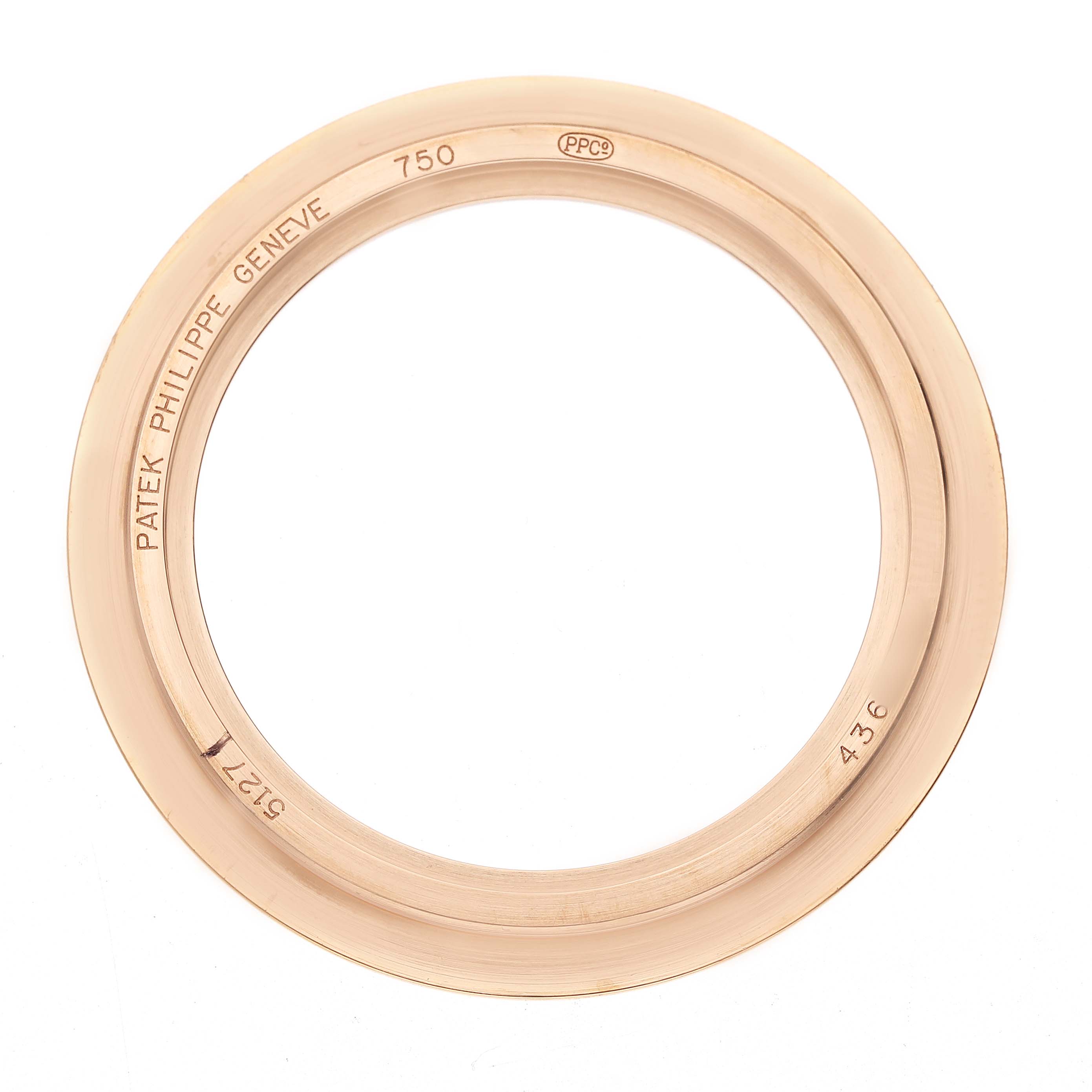 The image shows the bezel of a Patek Philippe Calatrava 5127 Men's Rose Gold Silver Dial watch, viewed from above.