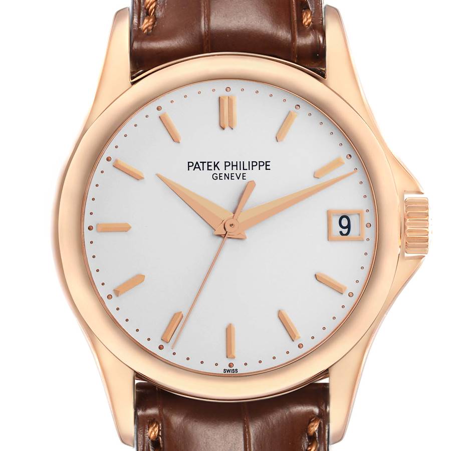 The image shows a front view of a Patek Philippe Calatrava 5127 Men's Rose Gold Silver Dial watch, highlighting its face, hands, date window, and brown leather strap.