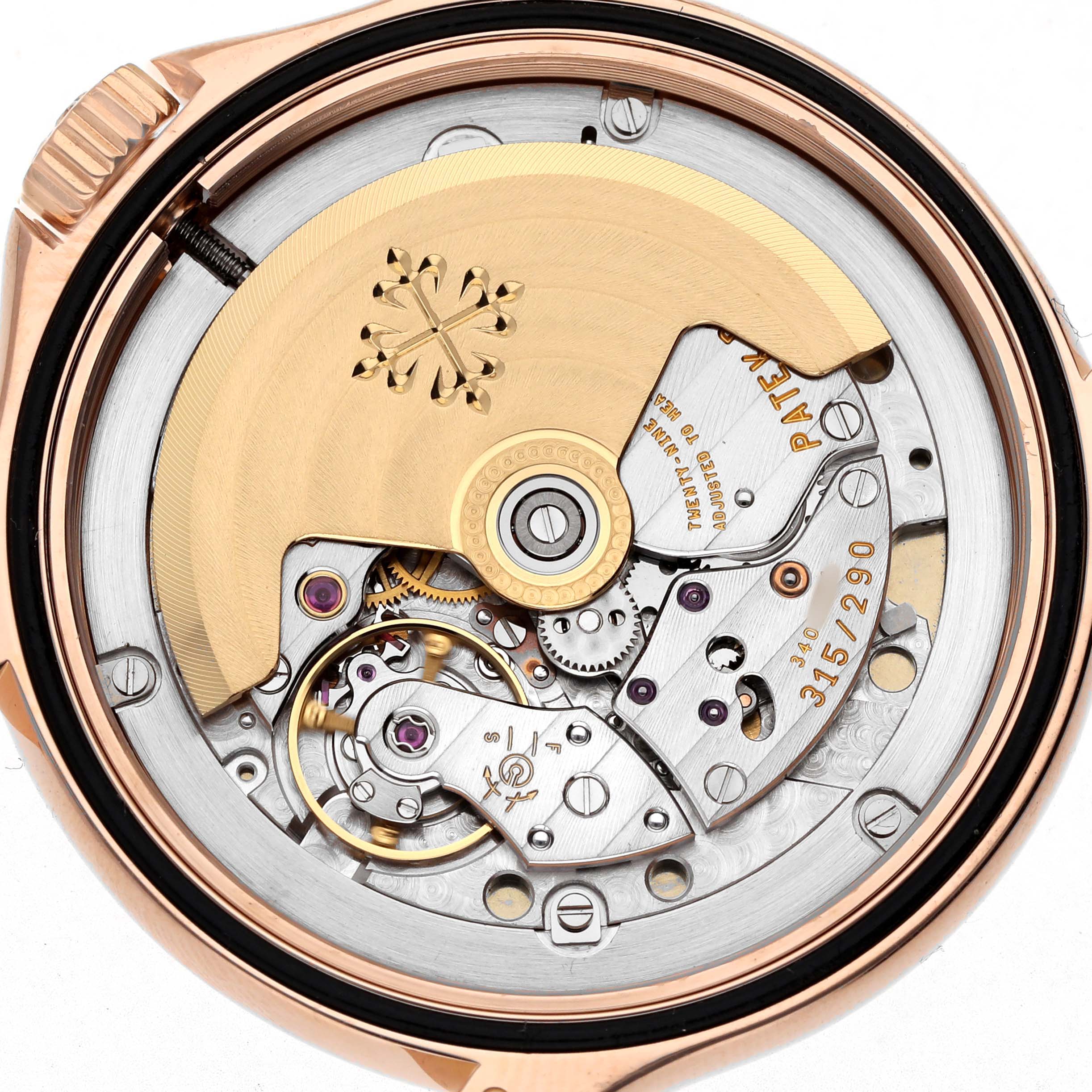 The image shows the back view of the Patek Philippe Calatrava 5127 Men's Rose Gold Silver Dial watch, displaying its intricate movement and rotor.