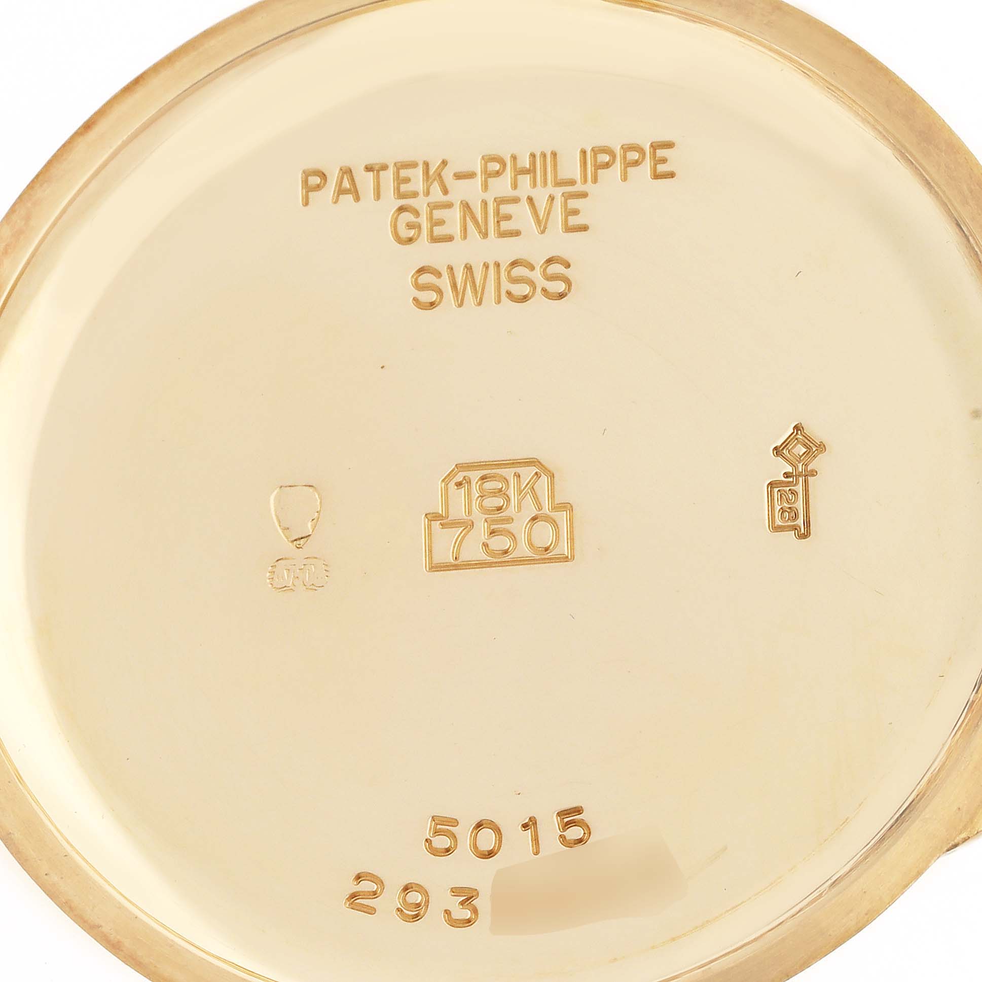 This image shows the inner case back of a Patek Philippe Calatrava 5015J-001 Men's Yellow Gold White Dial 5015J-001 Men's Yellow Gold White Dial watch with hallmark and model number details.