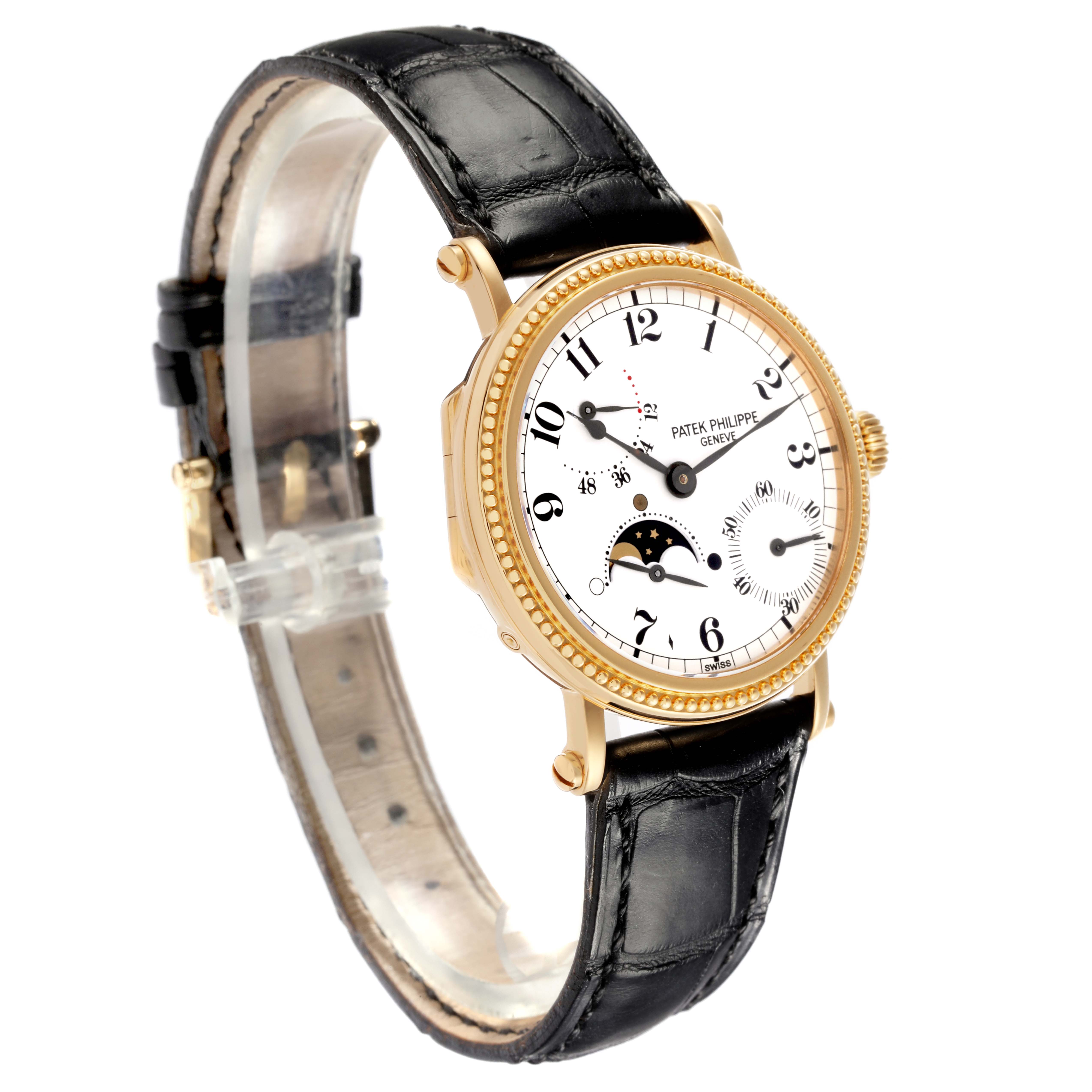 The Patek Philippe Calatrava 5015J-001 Men's Yellow Gold White Dial 5015J-001 Men's Yellow Gold White Dial watch is shown at an angle highlighting the face, bezel, and leather strap.