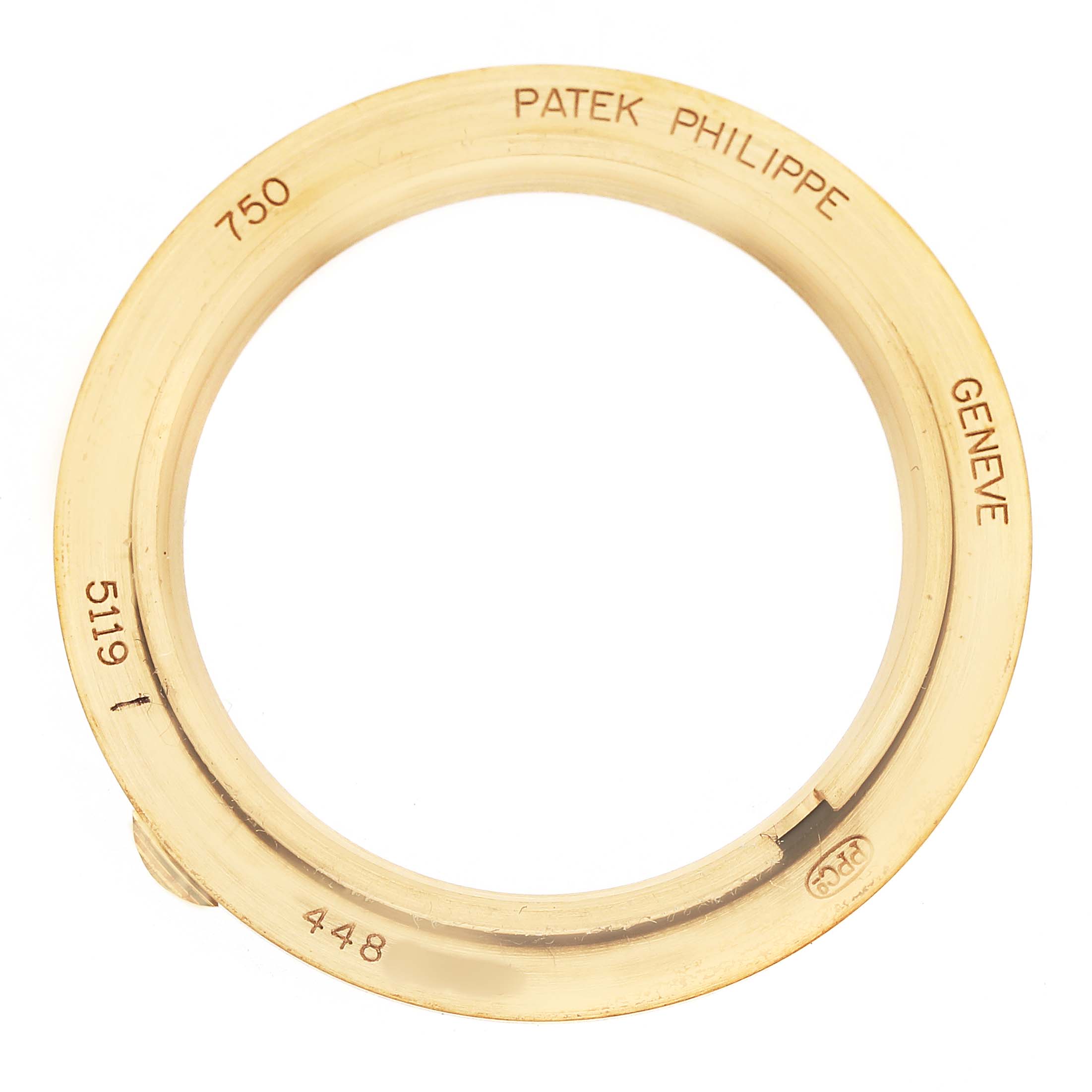 The image shows the bezel part of a Patek Philippe Calatrava 5119J-001 Men's Yellow Gold White Dial watch, model 5119, from a top view.