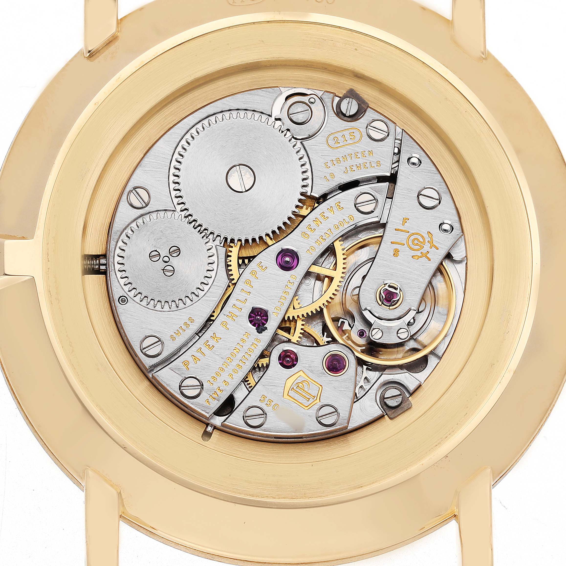 The image shows the Patek Philippe Calatrava 5119J-001 Men's Yellow Gold White Dial watch's intricate movement from the back, highlighting gears and mechanical components.