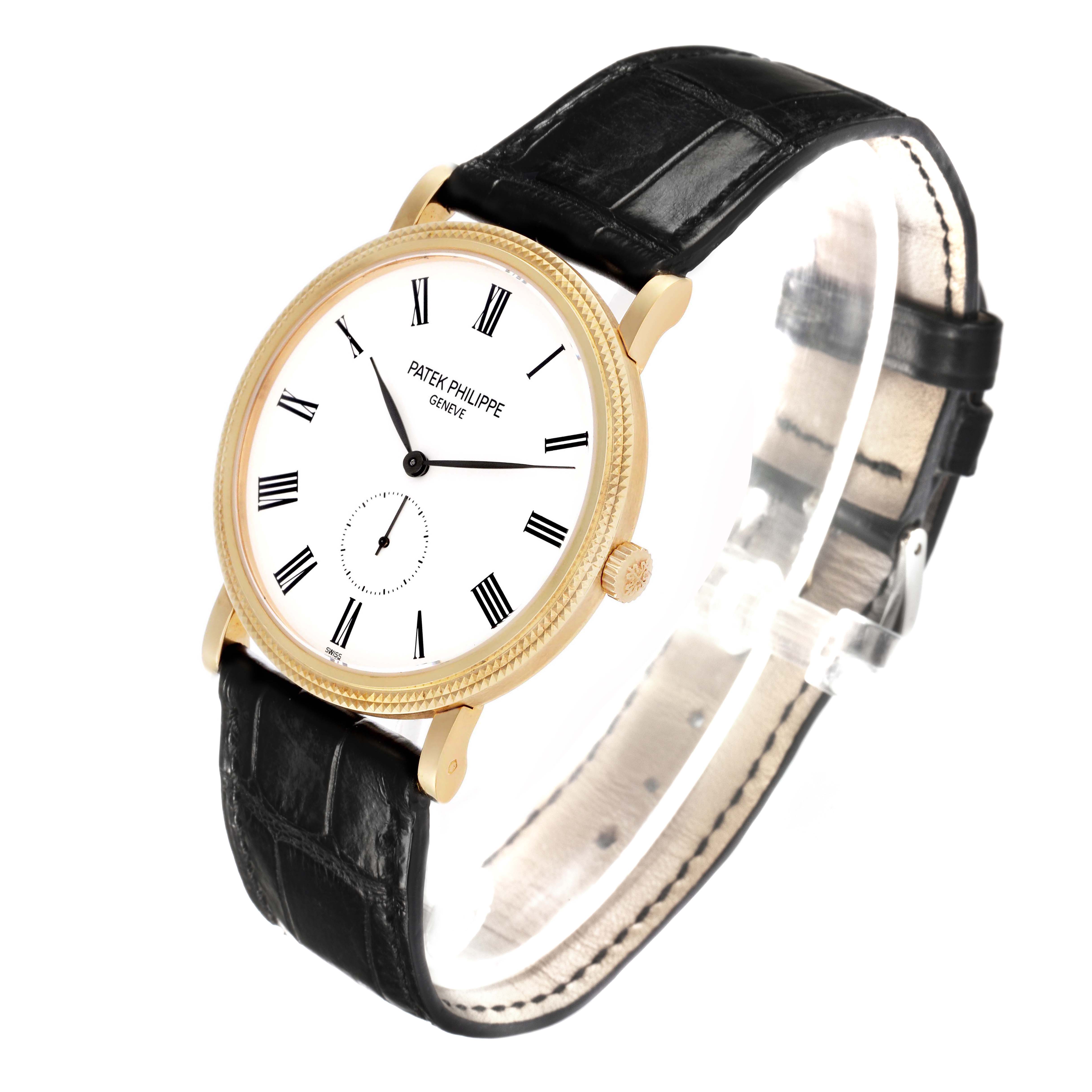 The Patek Philippe Calatrava 5119J-001 Men's Yellow Gold White Dial watch is shown at a three-quarter angle, displaying its face, crown, and leather strap.