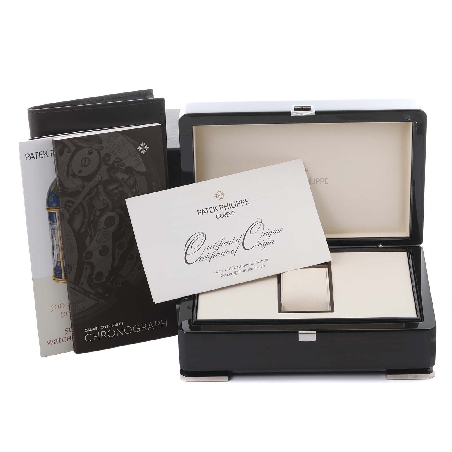 The image shows the Patek Philippe Complications 5170G-010 Men's White Gold Black Dial 5170G-010 Men's White Gold Black Dial watch box, certificate of origin, and manuals, with an open angle.