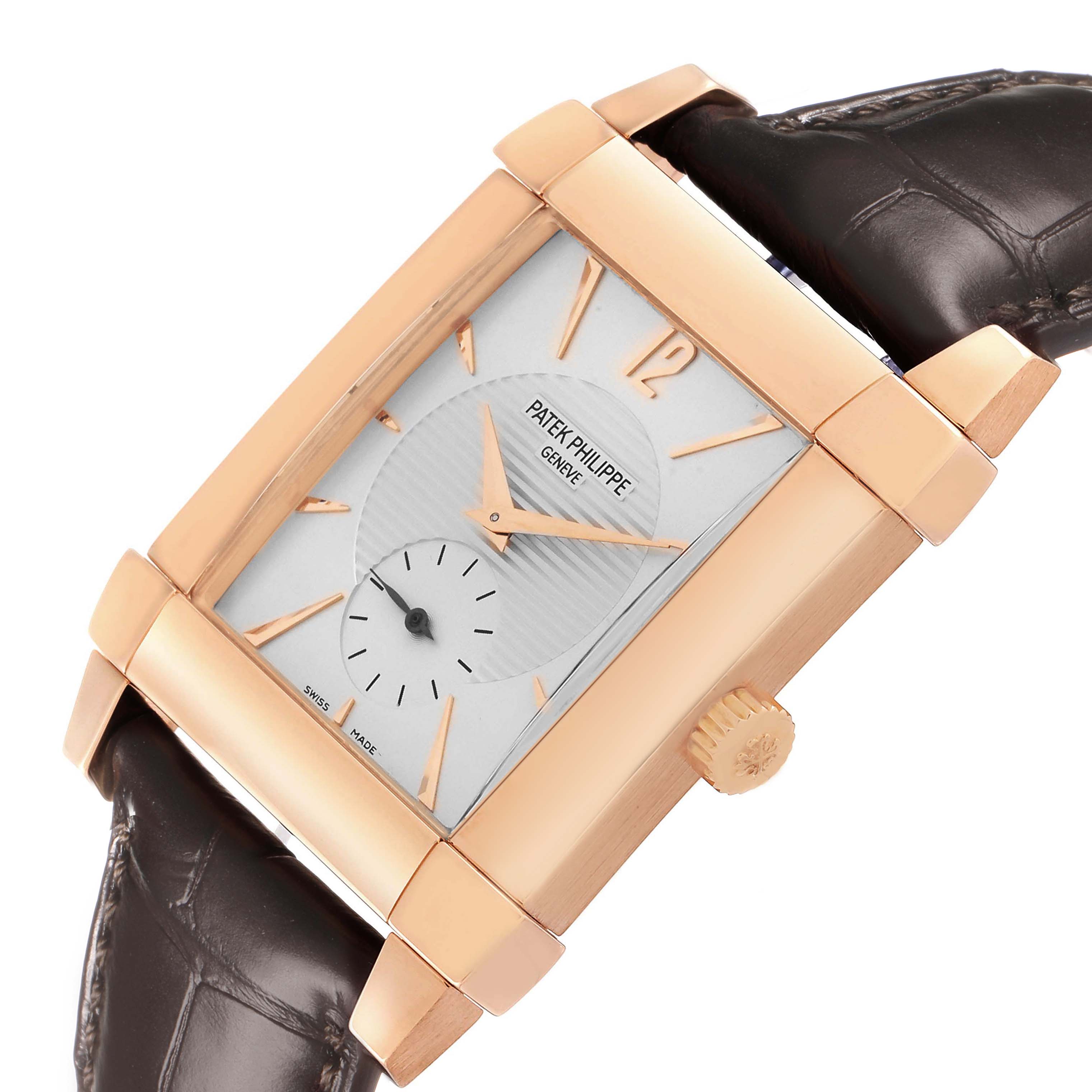 The Patek Philippe Gondolo 5111R-001 Men's Rose Gold Silver Dial watch is shown at an angle, highlighting its rectangular case, crown, dial, and leather strap.