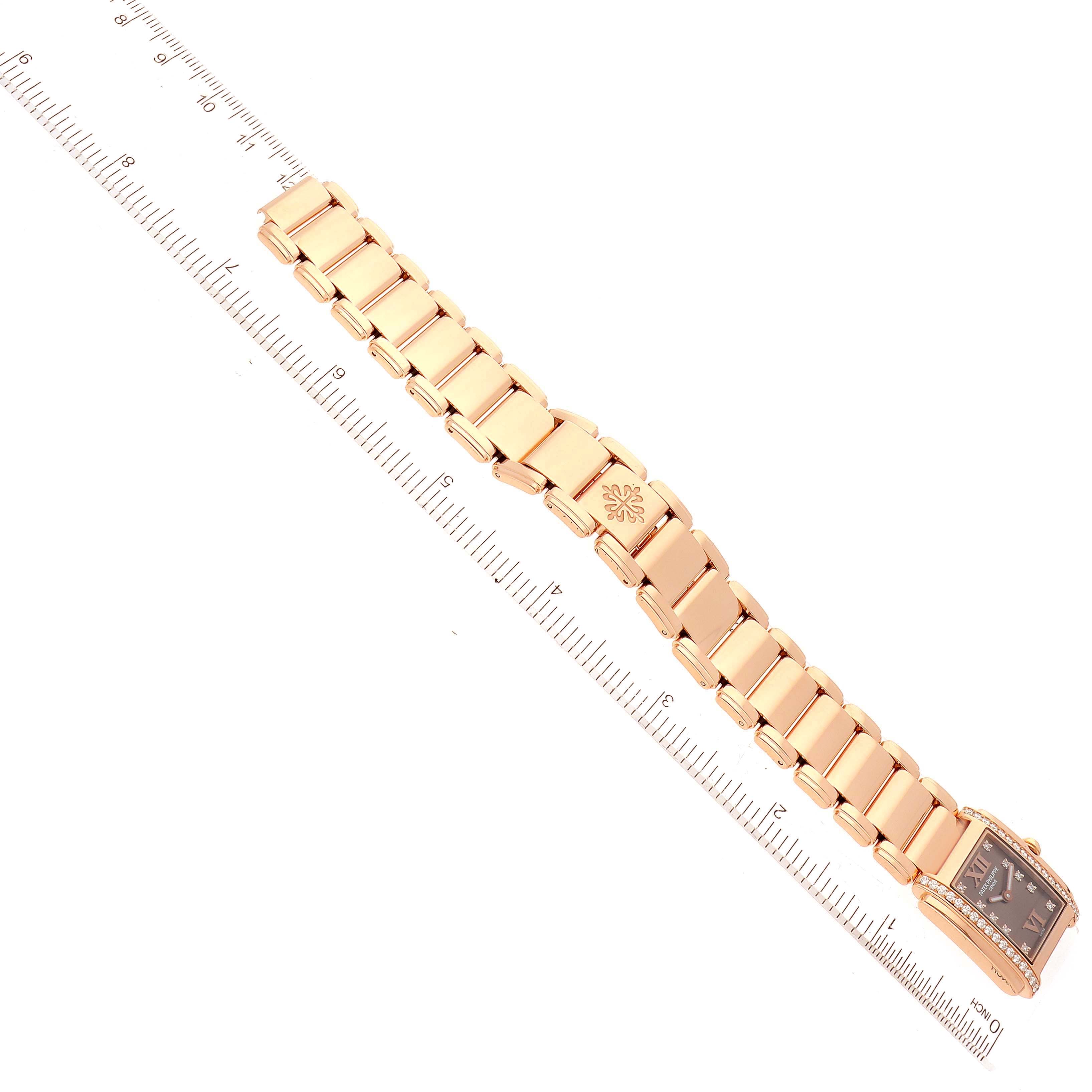 The image shows a Patek Philippe Twenty-4 4908/11R Women's Rose Gold Brown Dial 4908/11R Women's Rose Gold Brown Dial watch laid flat with a ruler for scale.
