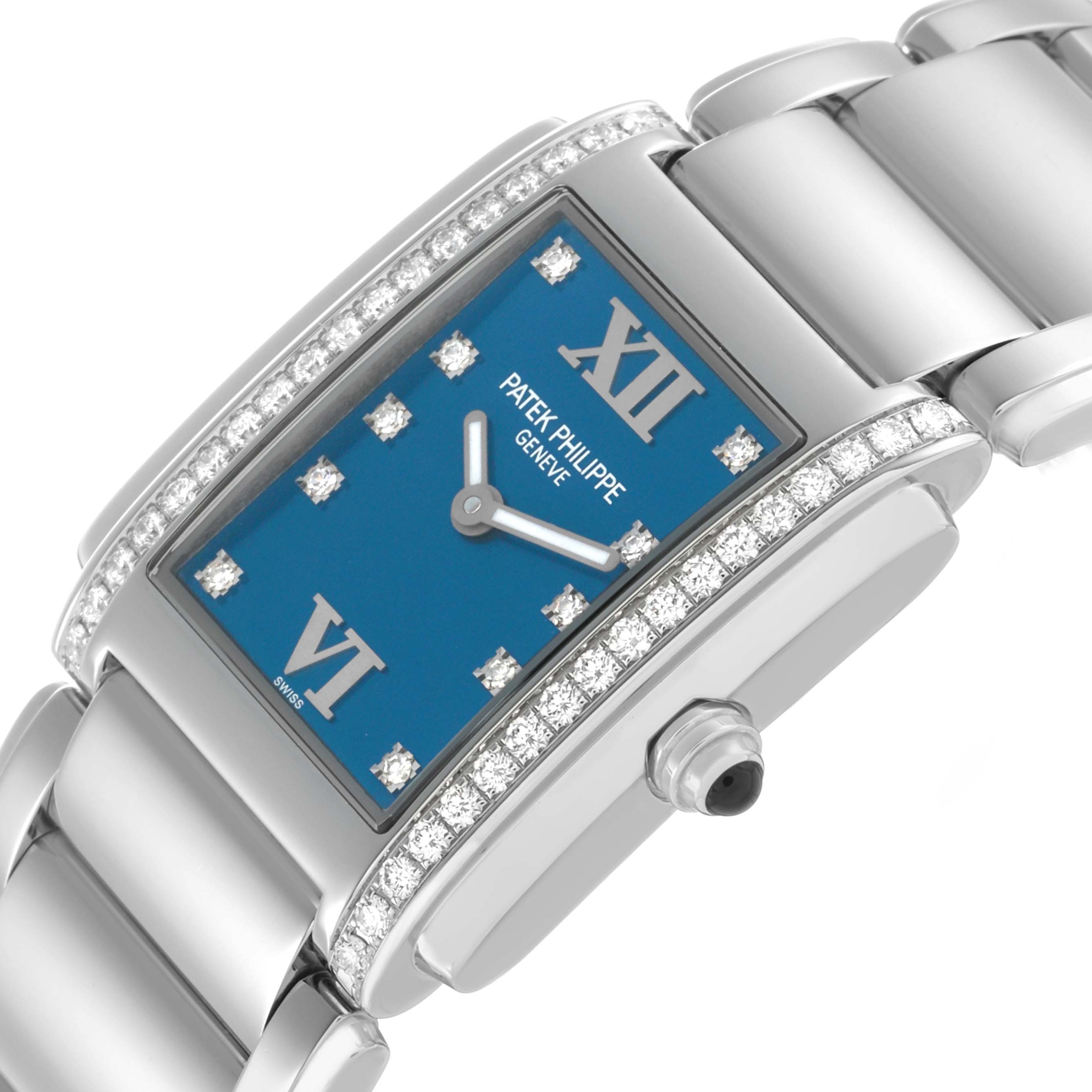 The Patek Philippe Twenty-4 4910/10A Women's Stainless Steel Blue Dial watch is angled to show the face, bezel with diamonds, crown, and part of the bracelet.