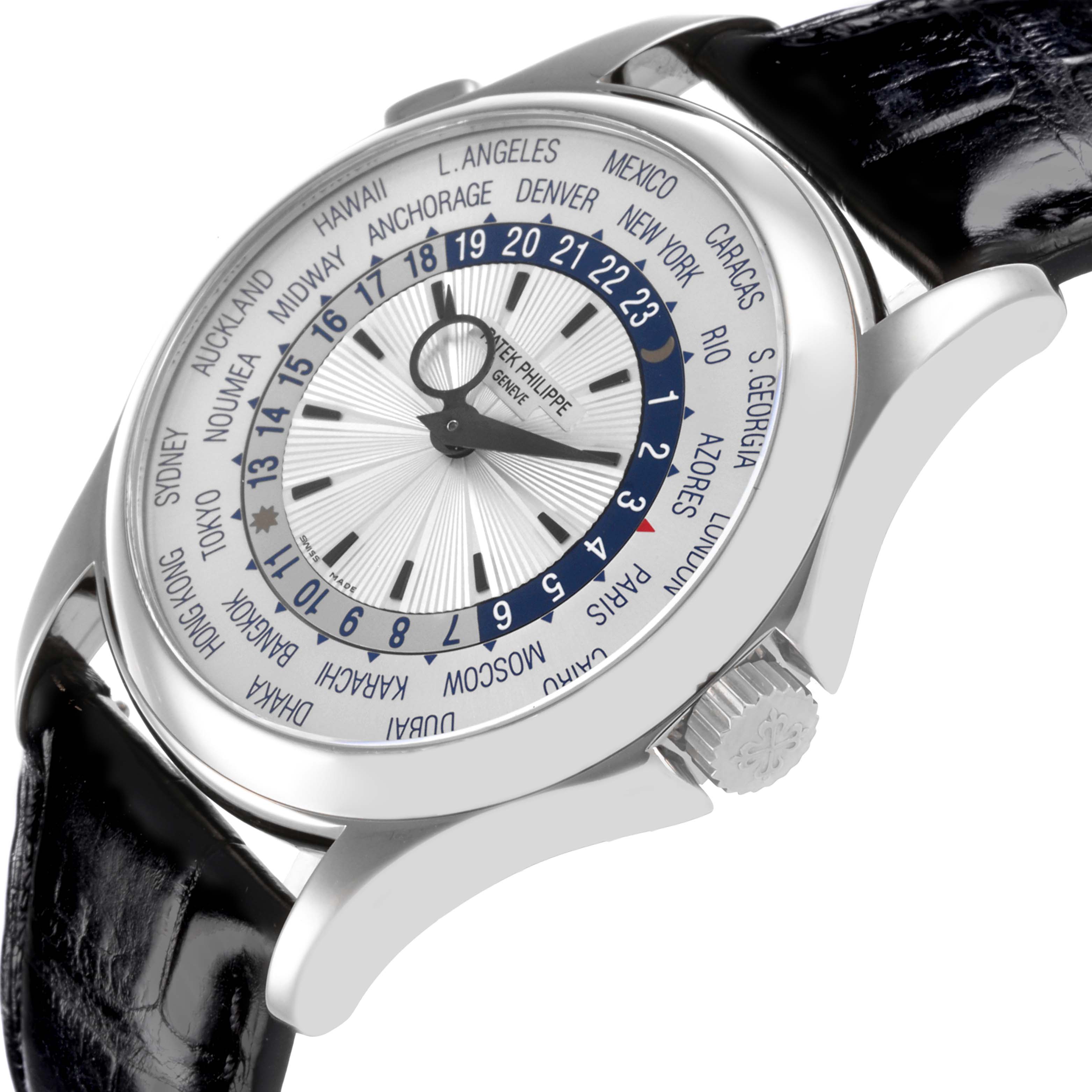 The Patek Philippe Complications 5130G Men
s White Gold Silver Dial 5130G Men
s White Gold Silver Dial watch is shown from a side angle, highlighting the dial, bezel, and crown.