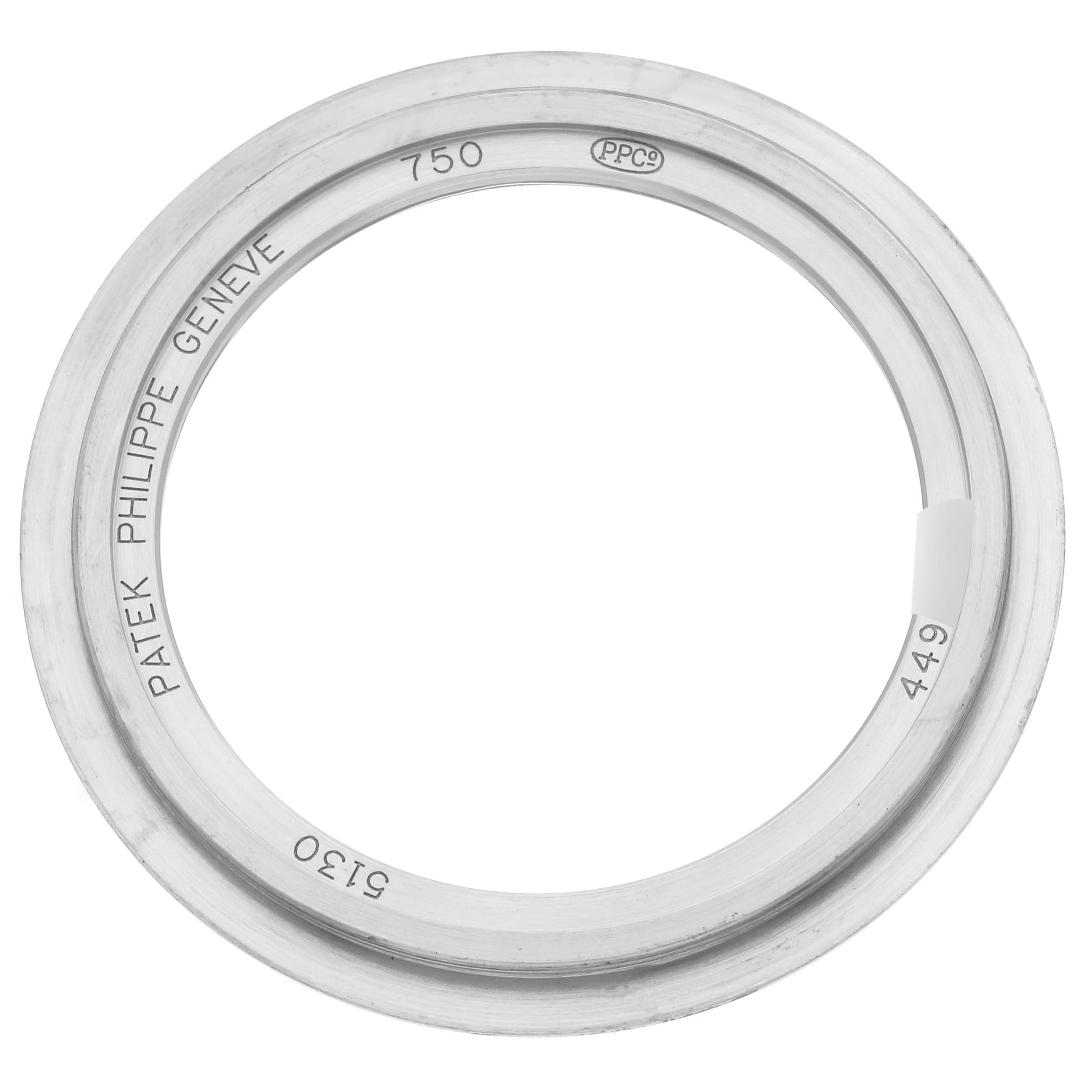 The image shows a top-down view of a Patek Philippe Complications 5130G Men
s White Gold Silver Dial 5130G Men
s White Gold Silver Dial model watch bezel.