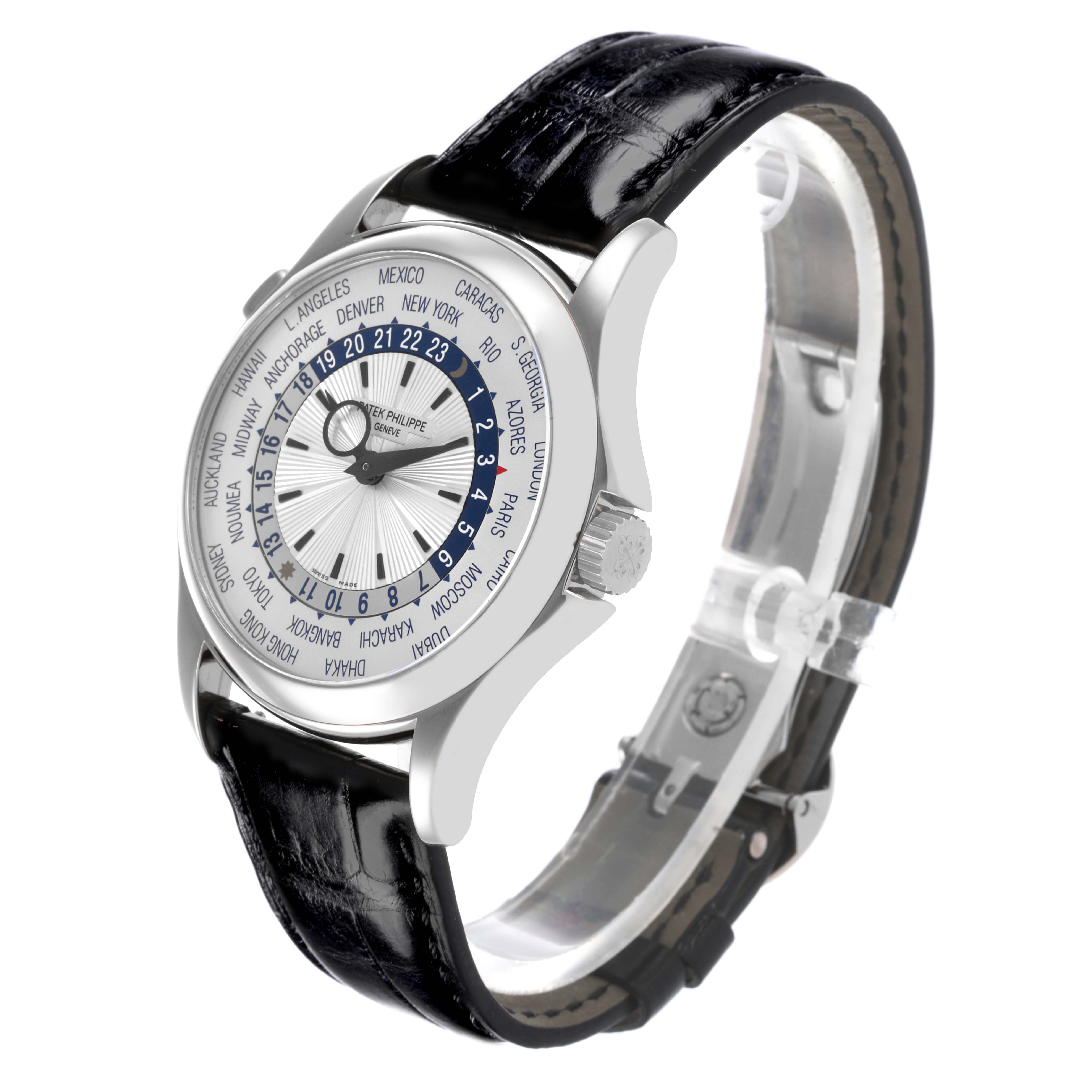 The Patek Philippe Complications 5130G Men
s White Gold Silver Dial 5130G Men
s White Gold Silver Dial watch is shown in a side angle, displaying the face, bezel, crown, and leather strap.