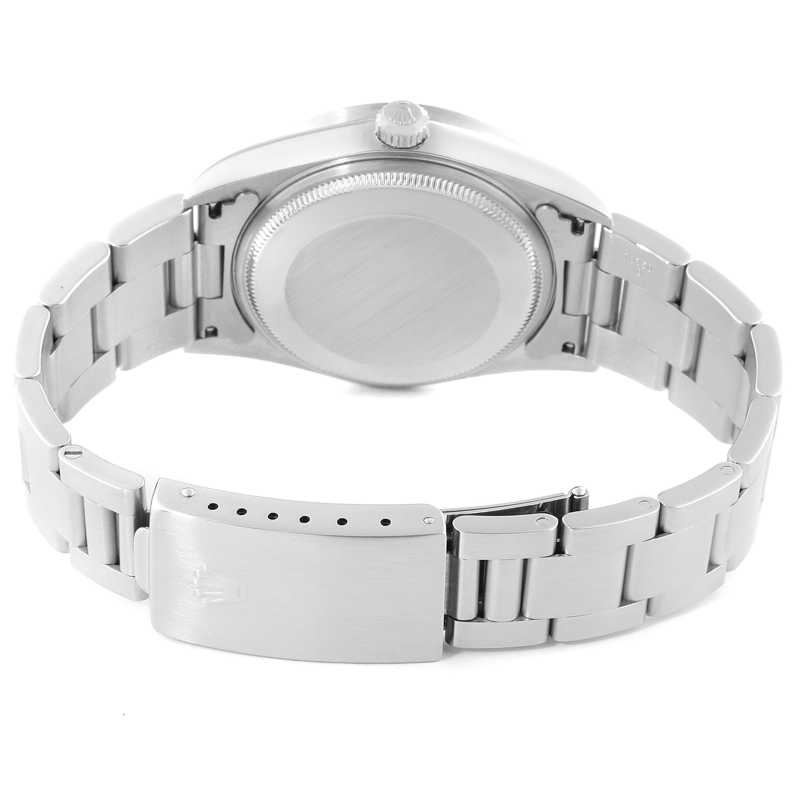 The Rolex Air-King 14010 Men's Stainless Steel Blue Dial 14010 Men's Stainless Steel Blue Dial watch is shown from the back, featuring its case back and metal bracelet with the clasp.