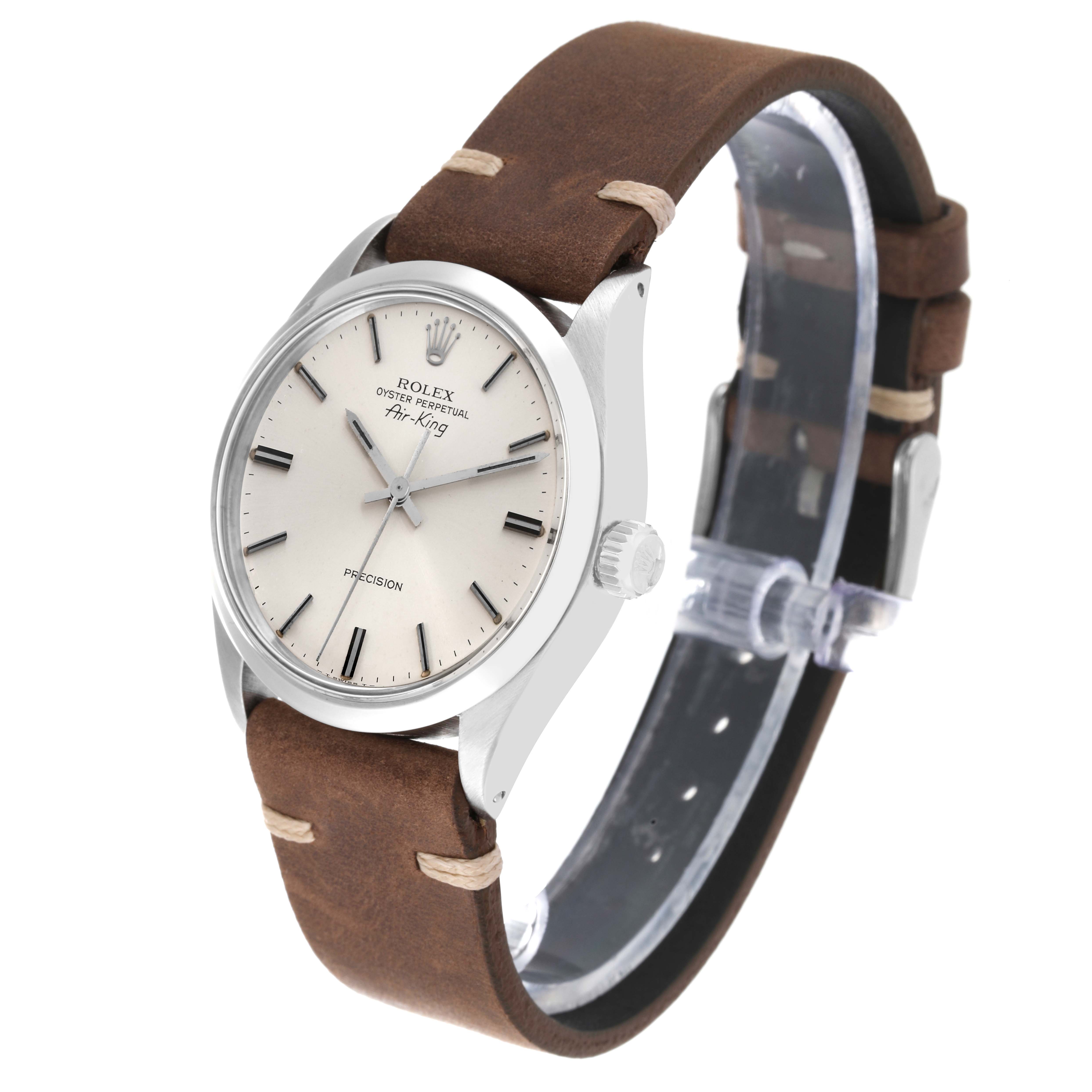 The image shows a side angle of the Rolex Vintage Collection 5500 Men's Stainless Steel Silver Dial 5500 Men's Stainless Steel Silver Dial Air-King watch with a brown leather strap and silver dial.