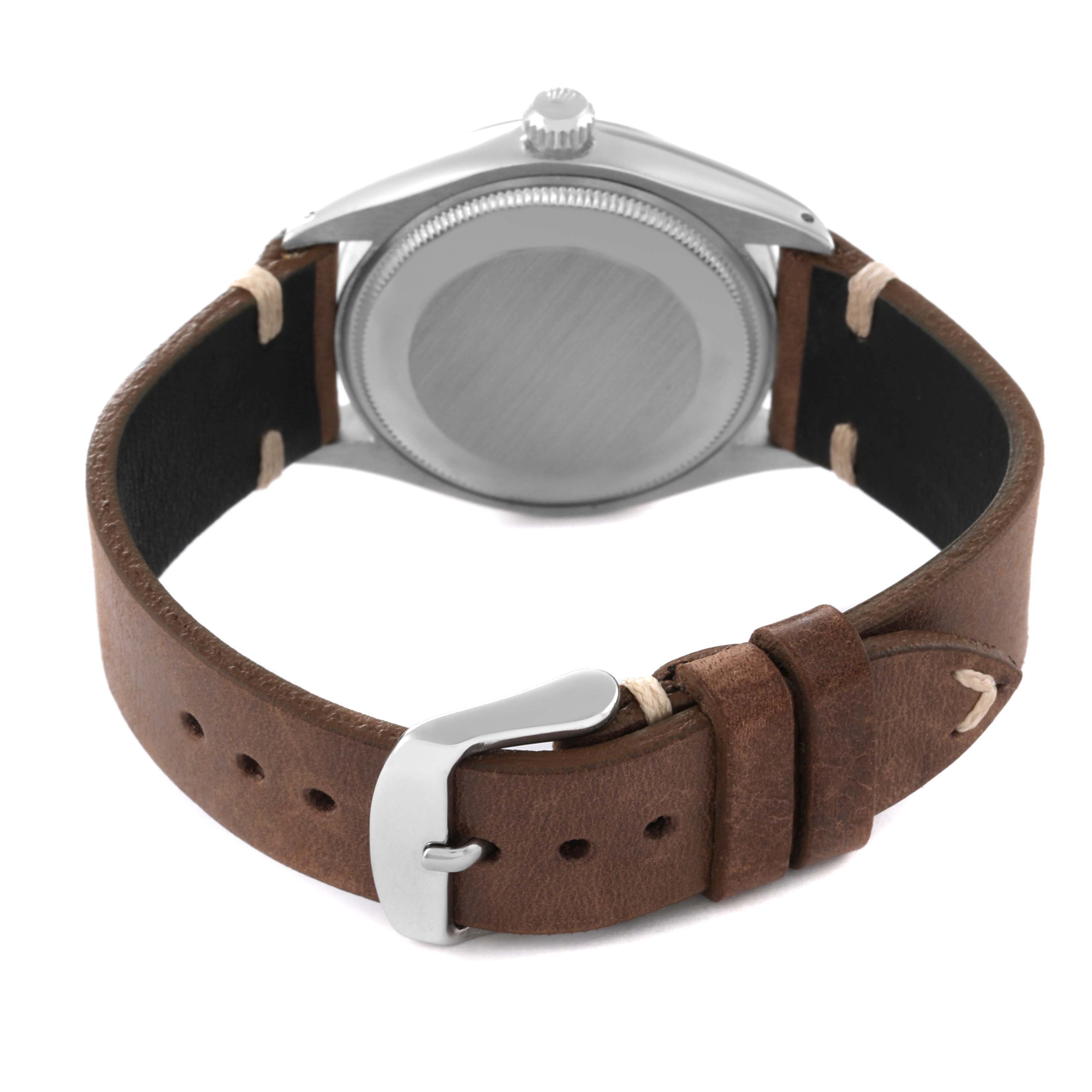 The image shows the back view of a Rolex Vintage Collection 5500 Men's Stainless Steel Silver Dial 5500 Men's Stainless Steel Silver Dial watch with a brown leather strap and silver buckle.