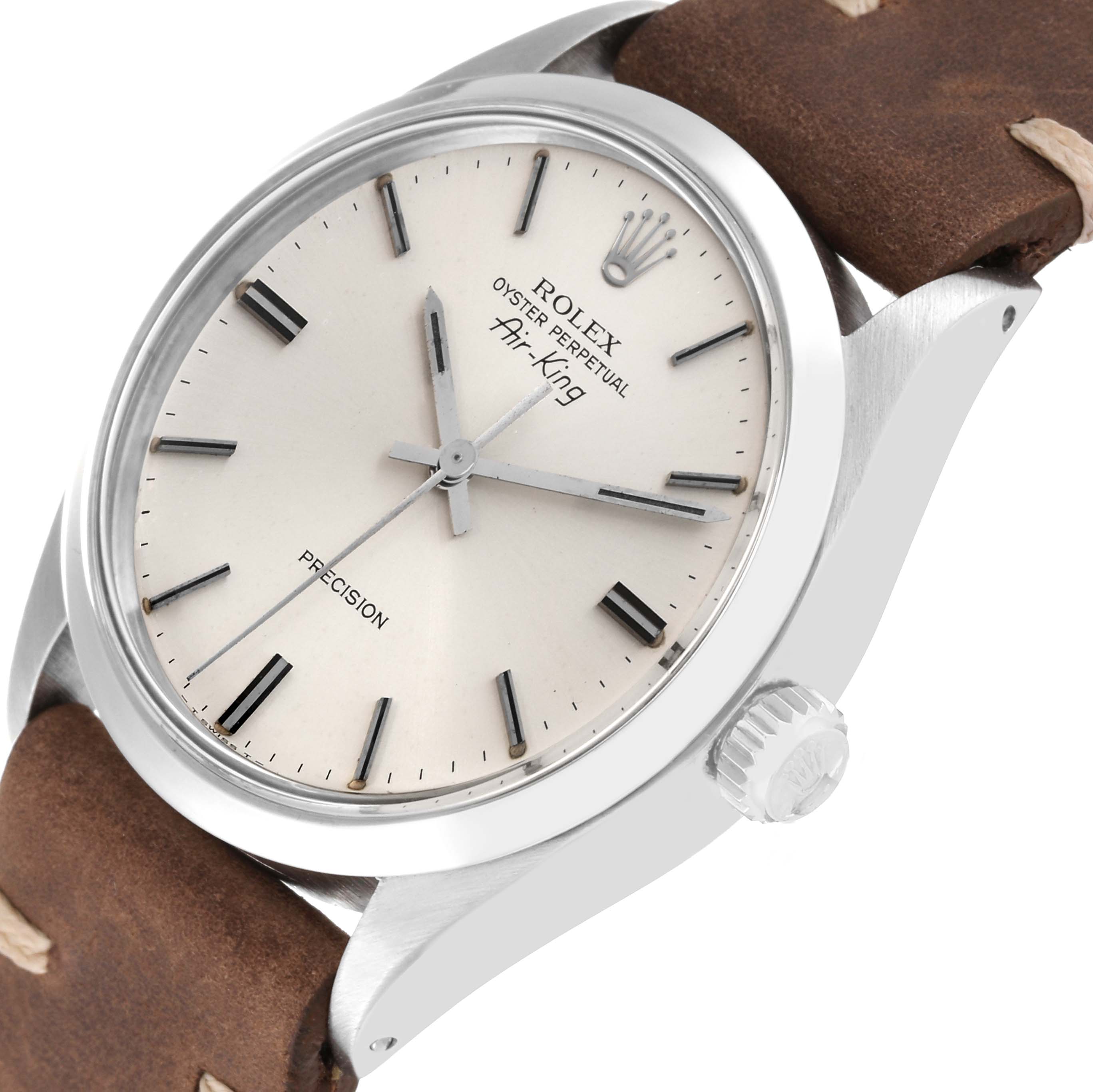 The image shows a close-up of the Rolex Vintage Collection 5500 Men's Stainless Steel Silver Dial 5500 Men's Stainless Steel Silver Dial model, highlighting the dial, crown, and part of the leather strap.