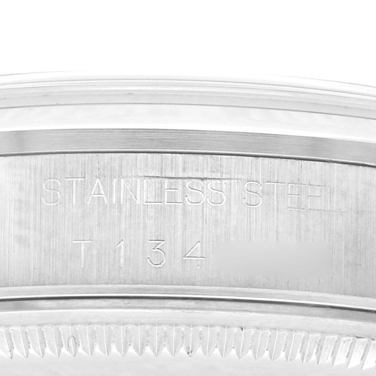 The image shows the side engraving of the stainless steel case of a Rolex Air-King 14000 Men's Stainless Steel White Dial 14000 Men's Stainless Steel White Dial watch.