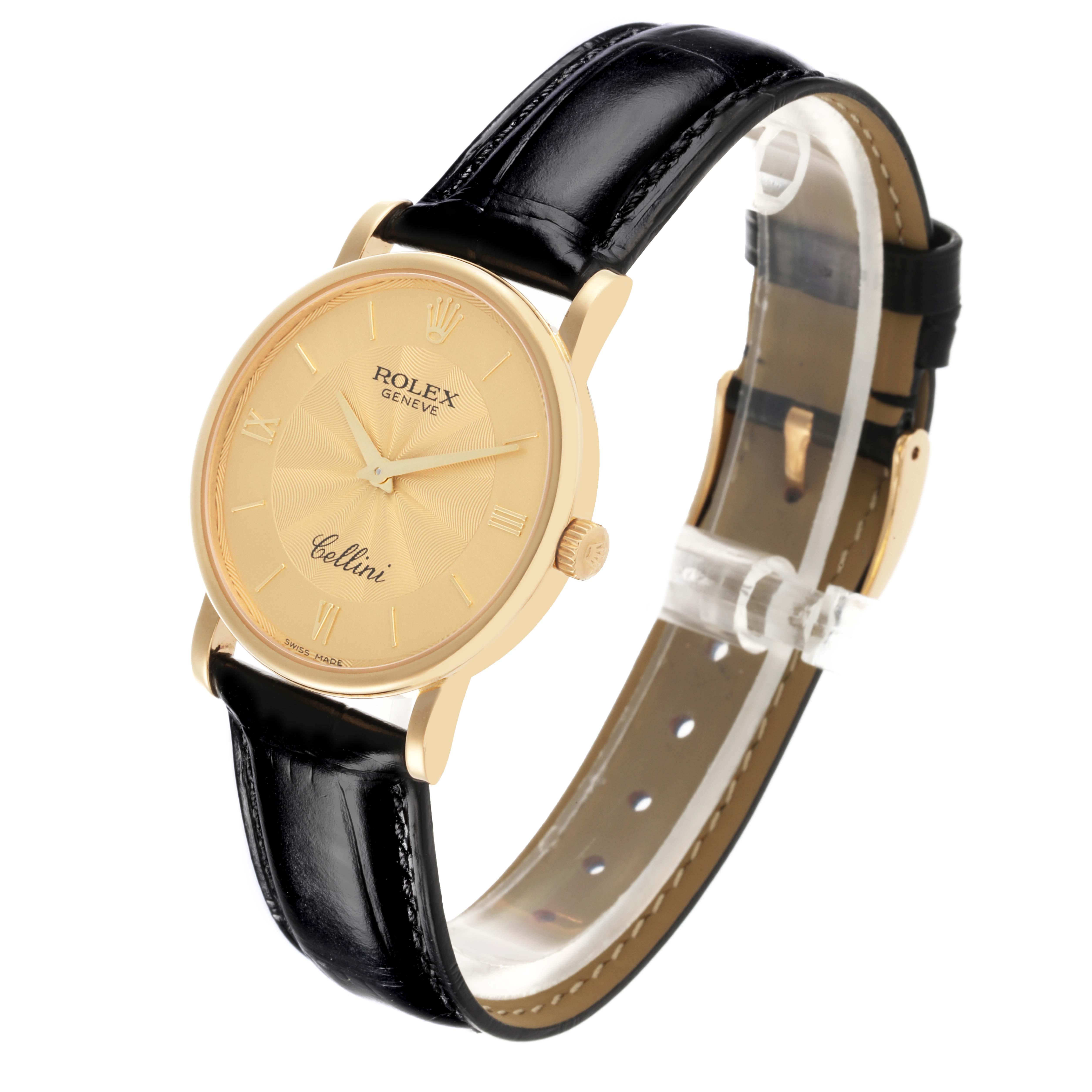 The Rolex Cellini 5115 Men's Yellow Gold Champagne Dial 5115 Men's Yellow Gold Champagne Dial watch is shown at a three-quarter angle, featuring its yellow dial, black leather strap, and gold case.