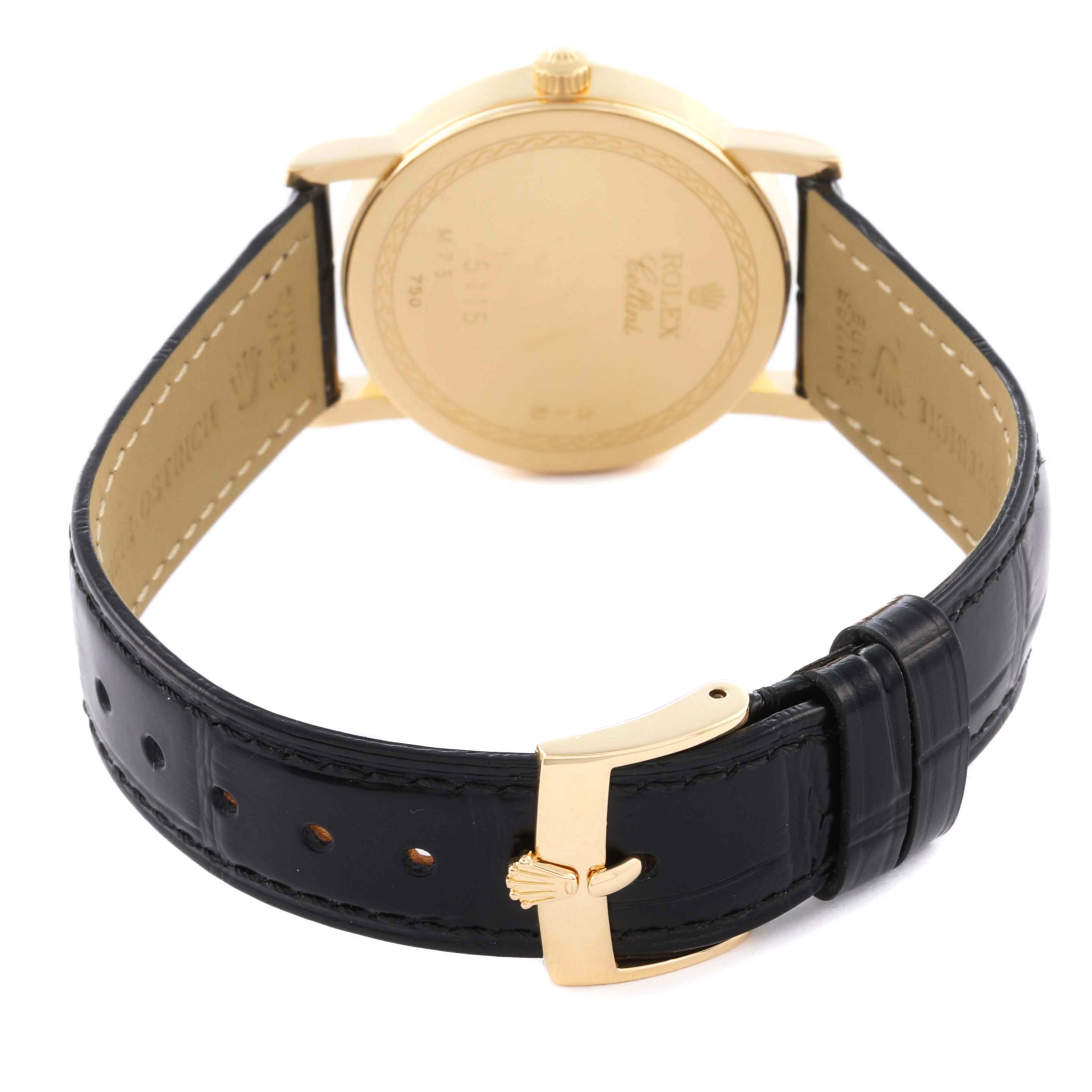 The image shows the back of the Rolex Cellini 5115 Men's Yellow Gold Champagne Dial 5115 Men's Yellow Gold Champagne Dial watch, with the leather strap, buckle, and case back visible.