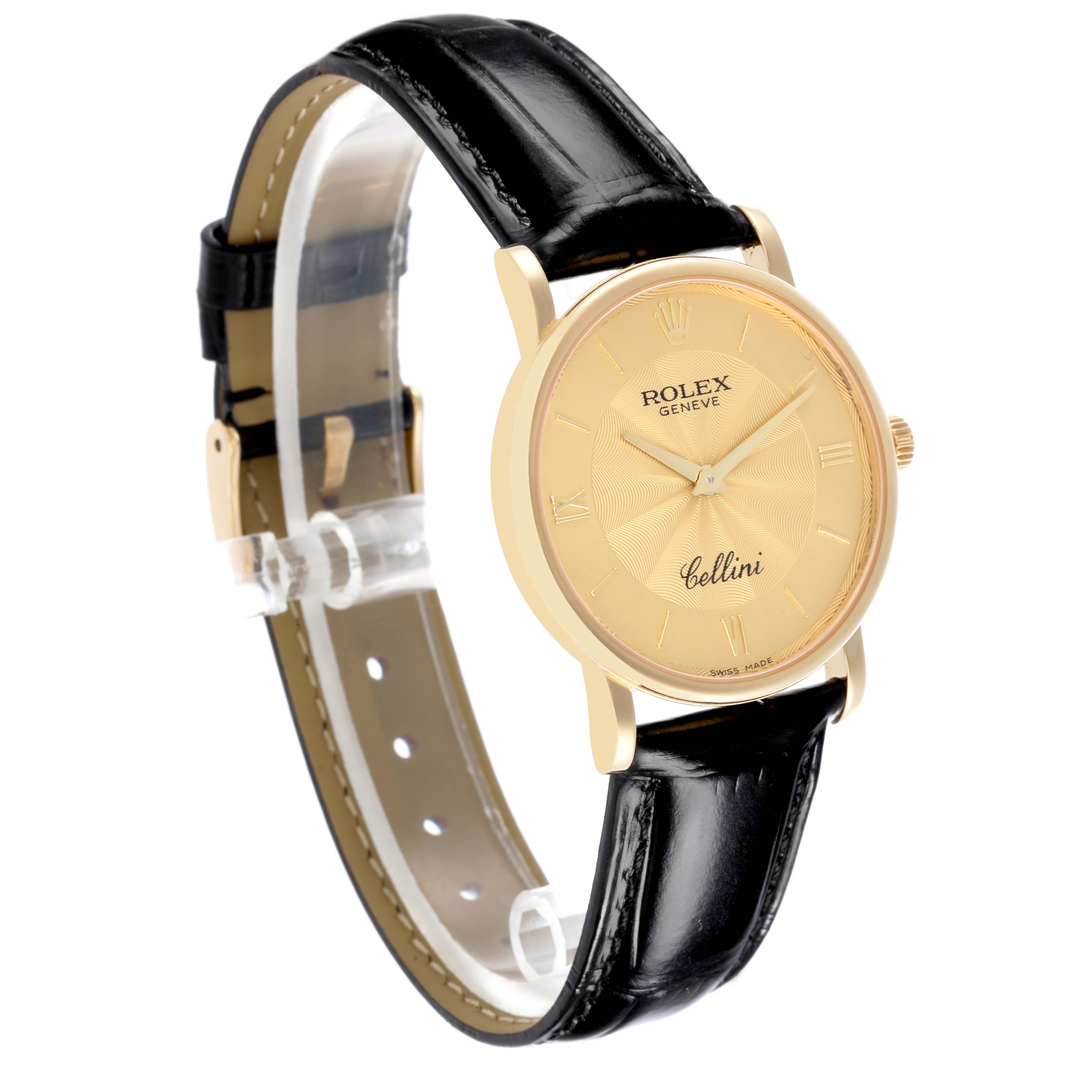 The Rolex Cellini 5115 Men's Yellow Gold Champagne Dial 5115 Men's Yellow Gold Champagne Dial watch is shown at an angled side view, displaying its round gold case, dial, and black leather strap.