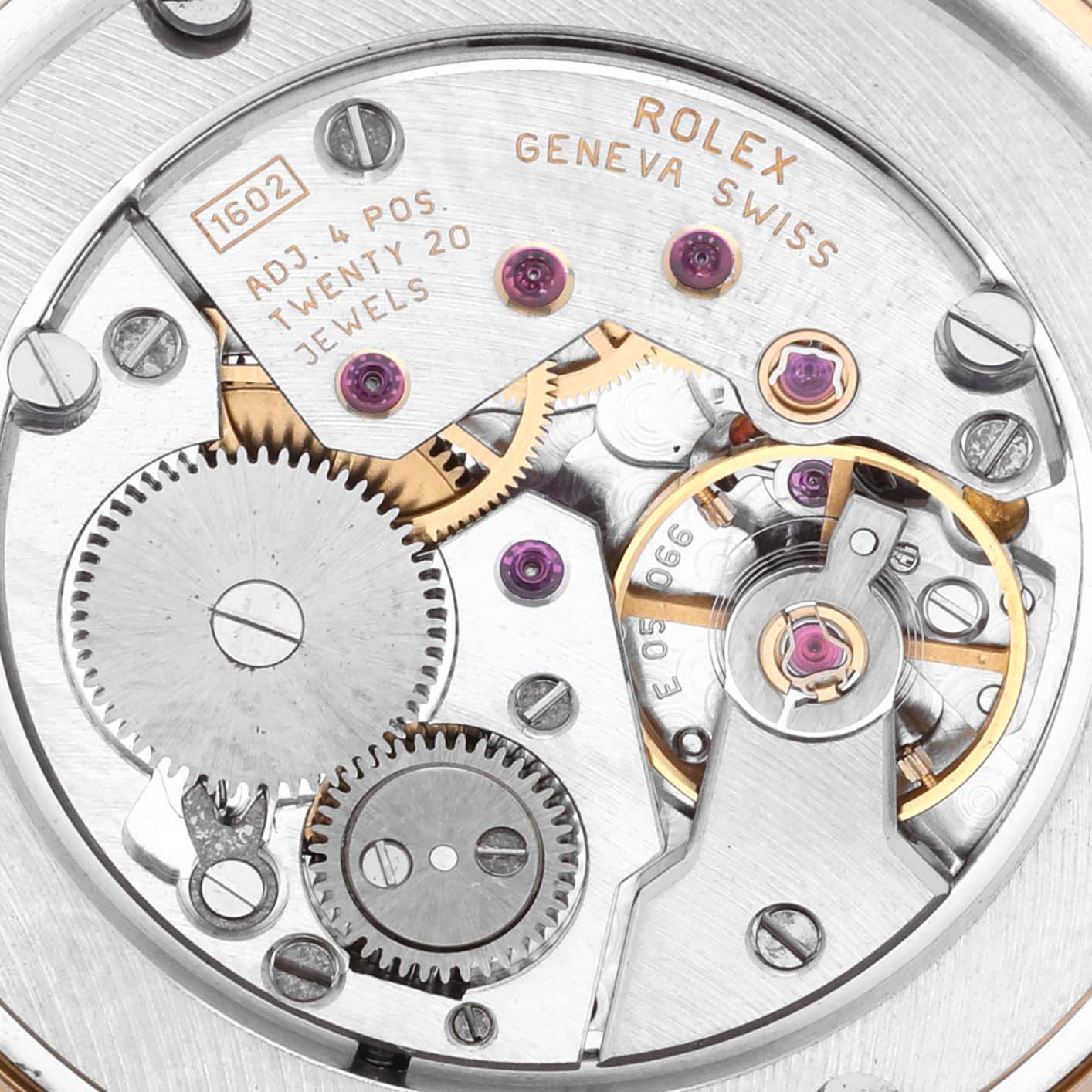 The image shows the movement of a Rolex Cellini 5115 Men's Yellow Gold Champagne Dial 5115 Men's Yellow Gold Champagne Dial model from a top-down angle, highlighting gears and jewels.