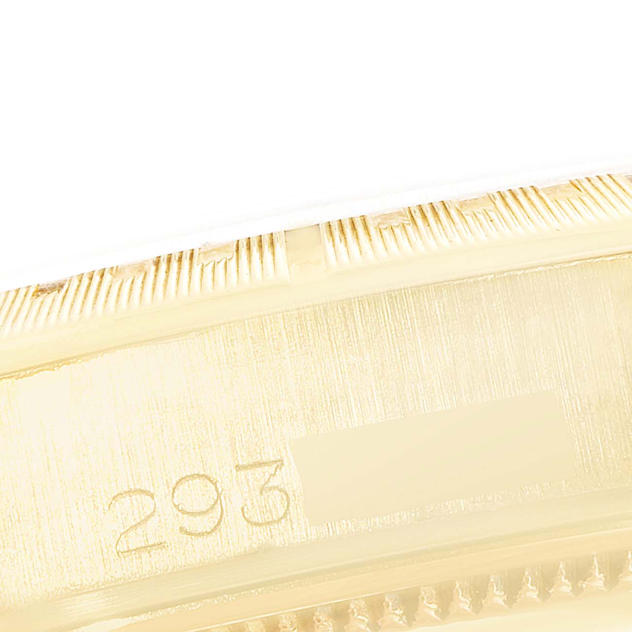 This image shows a close-up of the side casing and serial number engraving on a Vintage Collection Rolex watch.