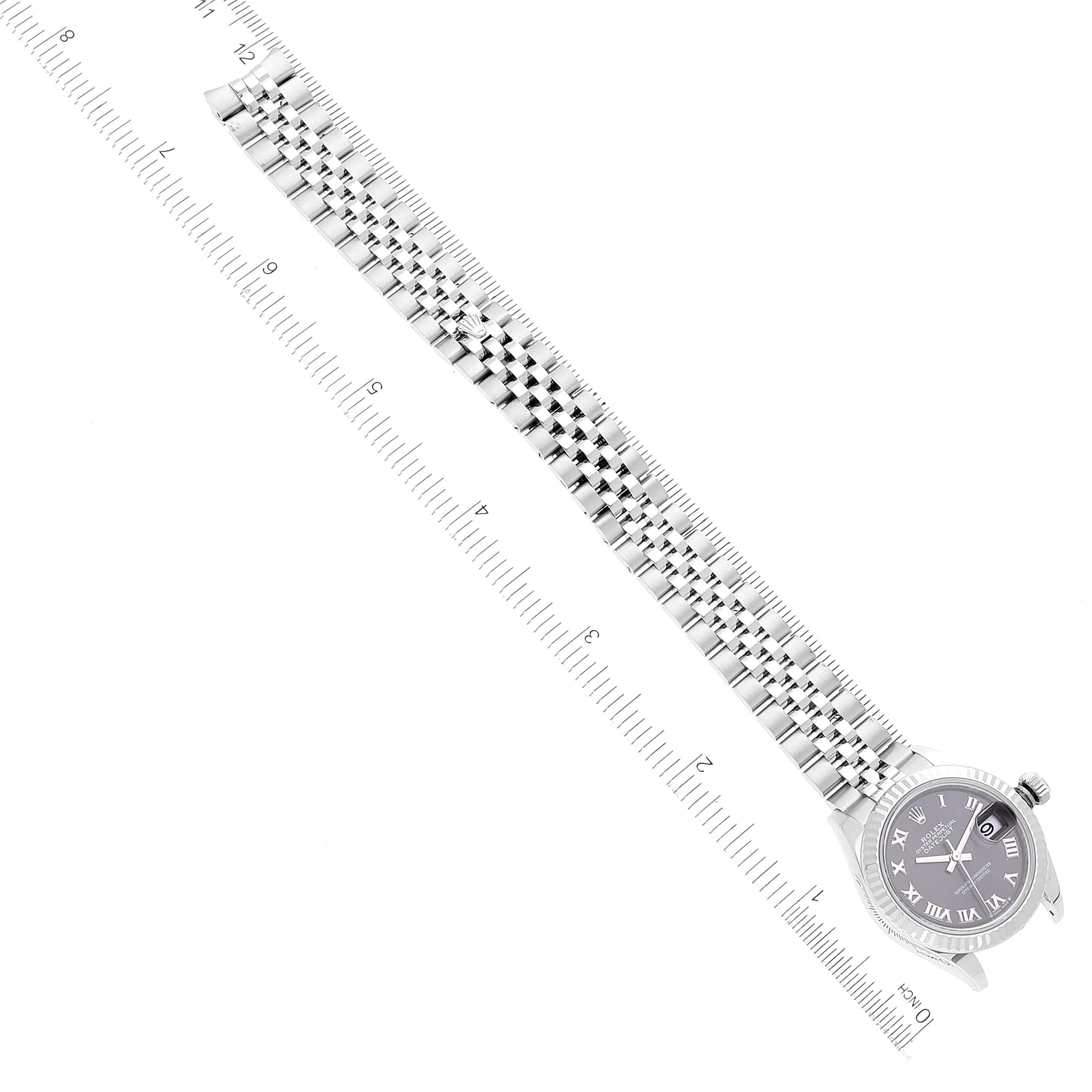 The image shows a top-down view of a Rolex Datejust 279174 Women's Stainless Steel Grey Dial 279174 Women's Stainless Steel Grey Dial watch, displaying its face, bezel, and full bracelet, aligned with a ruler for scale.