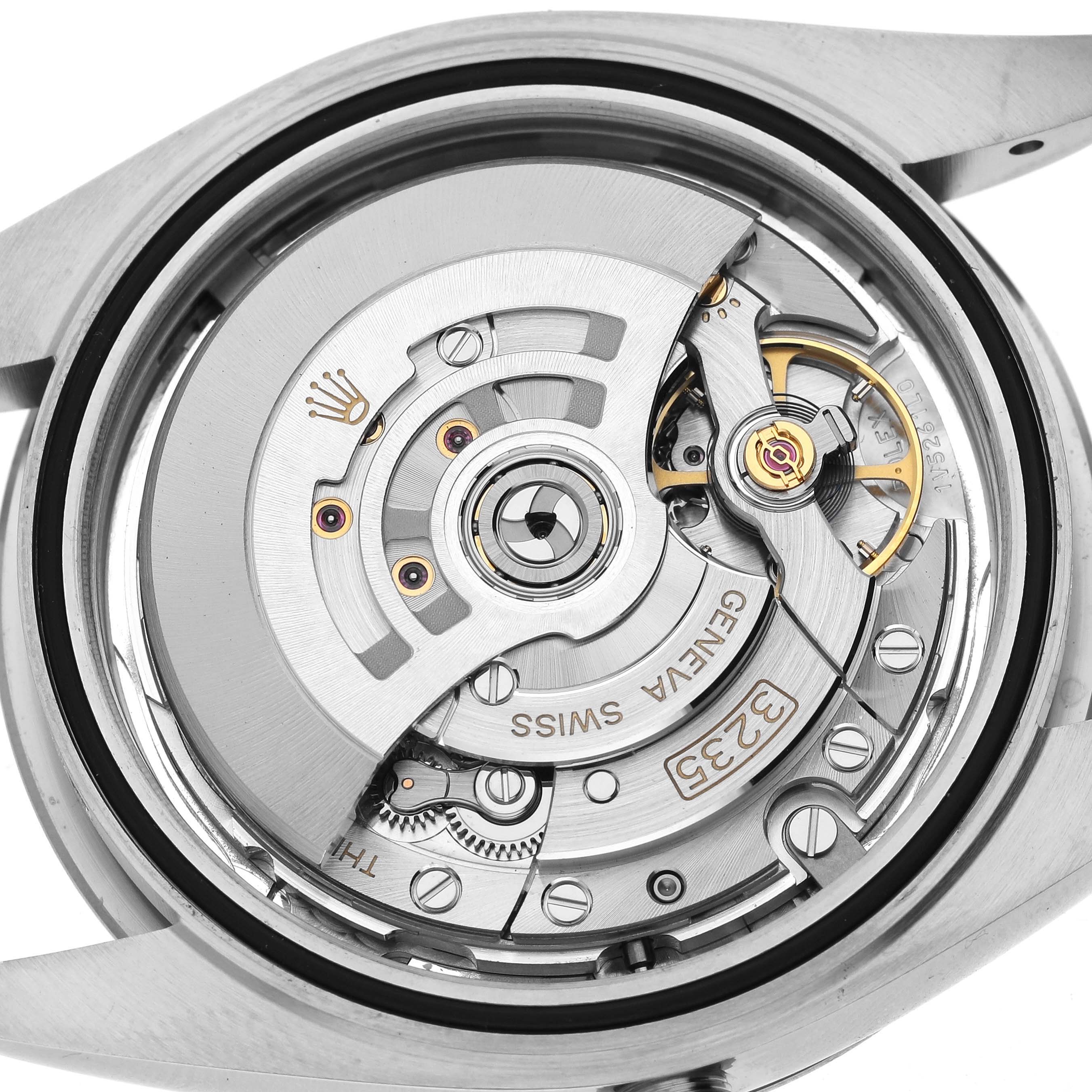 The image shows the open case back view of a Rolex Datejust 41 126334 Men's Stainless Steel Silver Dial, revealing its intricate internal movement components.