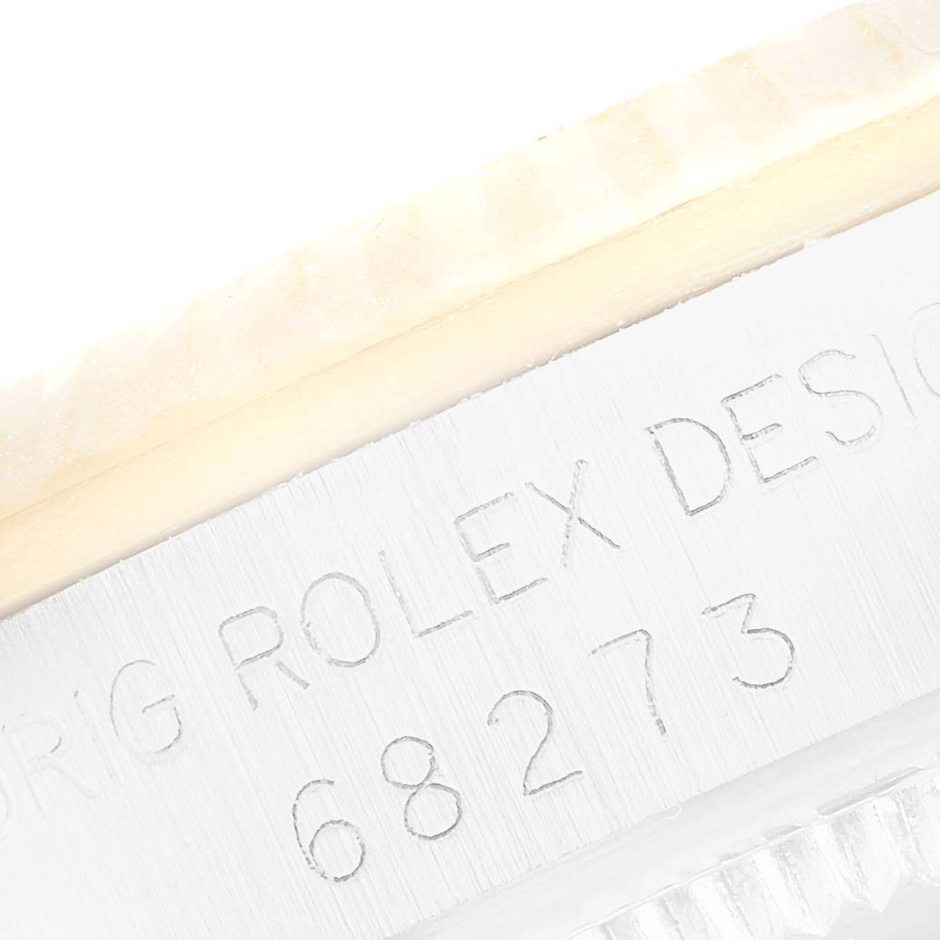 The image shows a close-up of the engraved side of a Mid-Size Rolex watch, model number 68273.