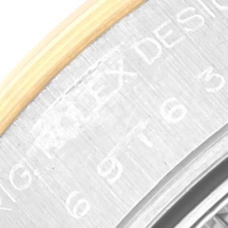 The image shows a close-up of the bezel and engraved side of a Rolex Datejust 69163 Women's Steel and Gold (two tone) Silver Dial 69163 Women's Steel and Gold (two tone) Silver Dial watch.
