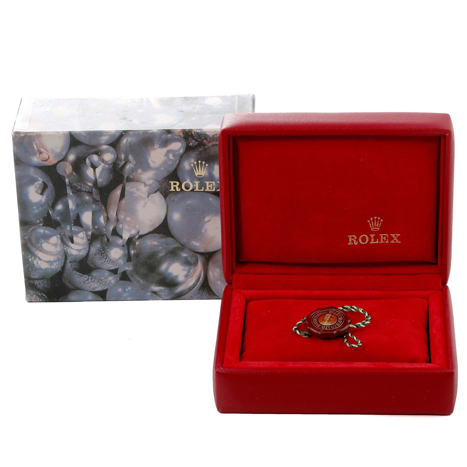 The image shows a Rolex Datejust 69163 Women's Steel and Gold (two tone) Silver Dial 69163 Women's Steel and Gold (two tone) Silver Dial box and tag accessory, with the box partially open to reveal the tag inside.