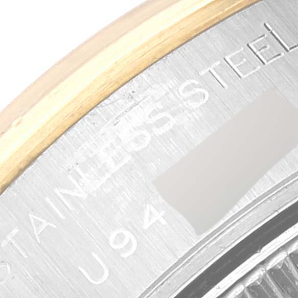 This close-up of a Rolex Datejust 69163 Women's Steel and Gold (two tone) Silver Dial 69163 Women's Steel and Gold (two tone) Silver Dial shows part of the bezel, case back, and engraved text.