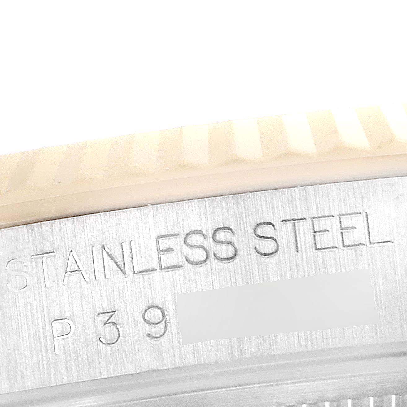 This close-up image shows the edge and part of the casing with "STAINLESS STEEL" engraved on a Rolex Datejust 16233 Men's Steel and Gold (two tone) Blue Dial 16233 Men's Steel and Gold (two tone) Blue Dial watch.