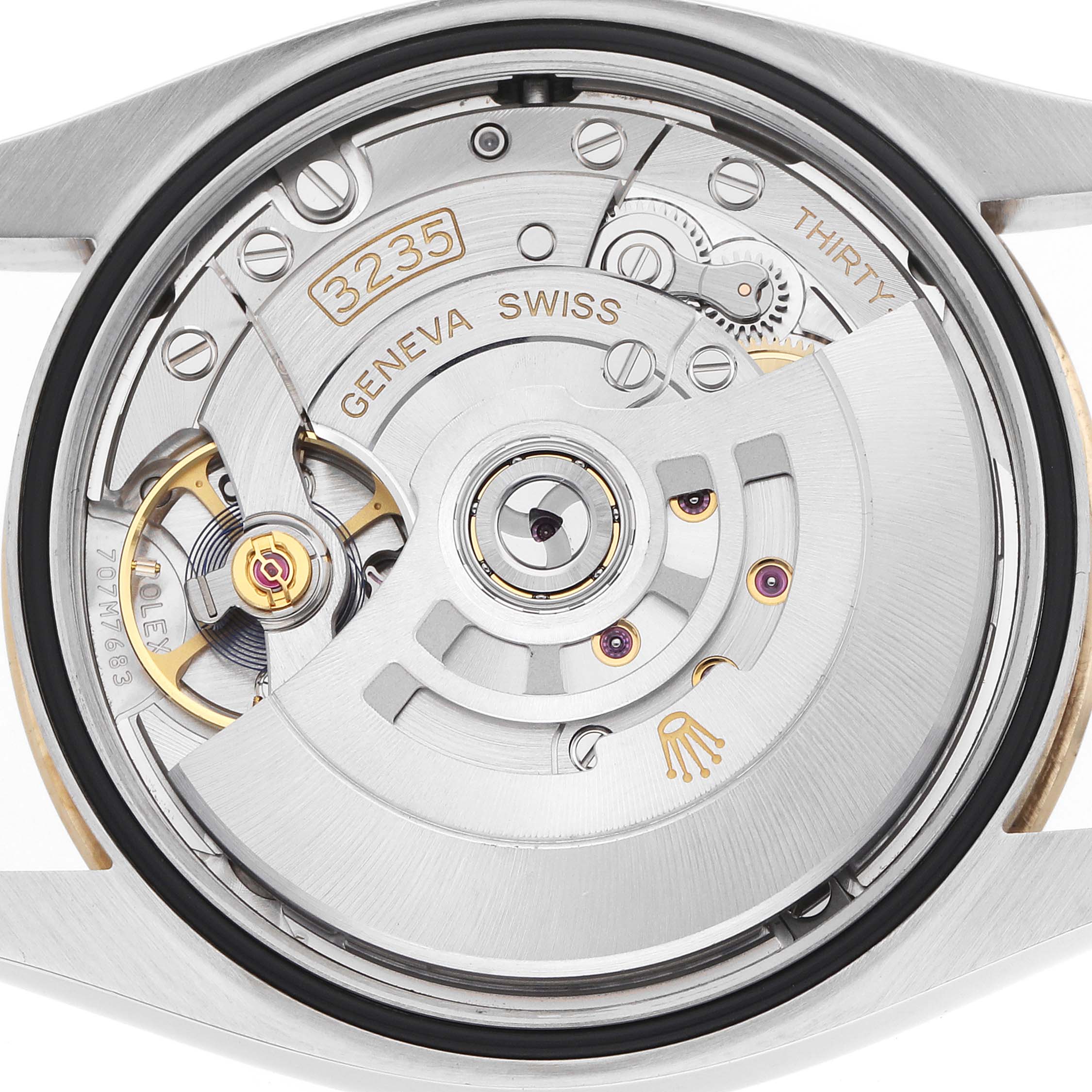 The image shows the movement mechanism of a Rolex Datejust 126233 Men's Steel and Gold (two tone) Champagne Dial, viewed from the back.