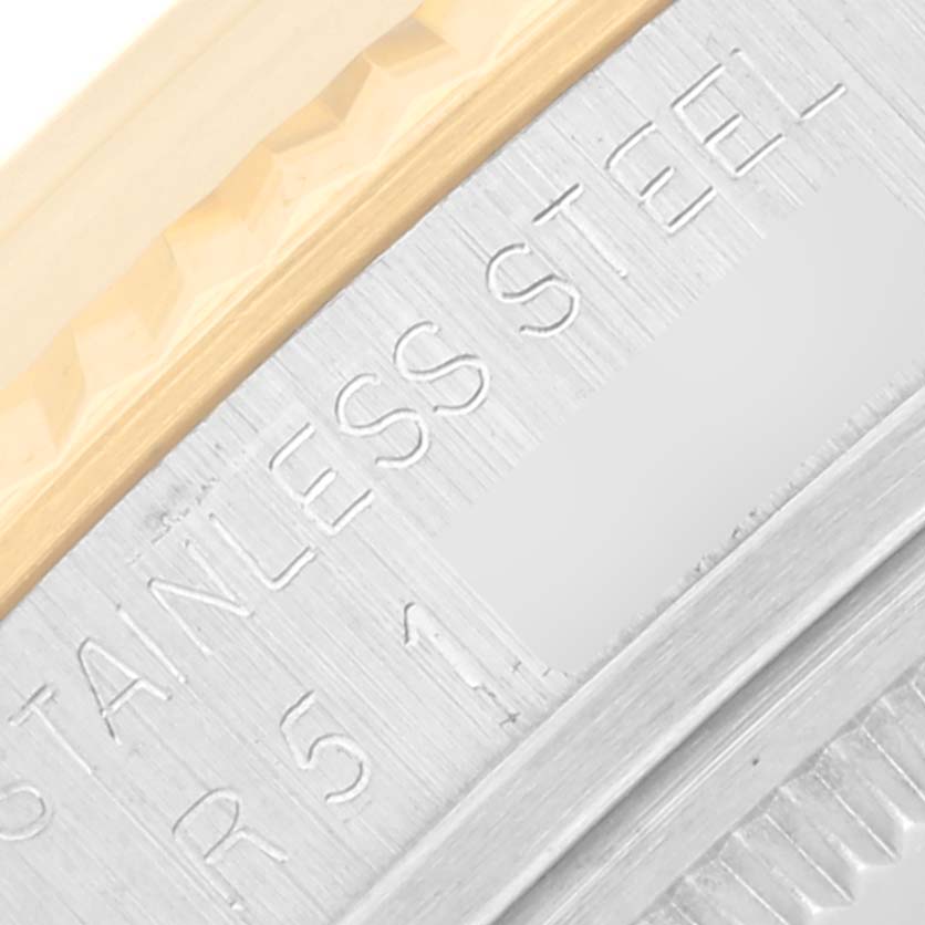 The image shows a close-up of the stainless steel and gold edge of the Rolex Vintage Collection 16013 Men's Steel and Gold (two tone) Champagne Dial 16013 Men's Steel and Gold (two tone) Champagne Dial watch case.