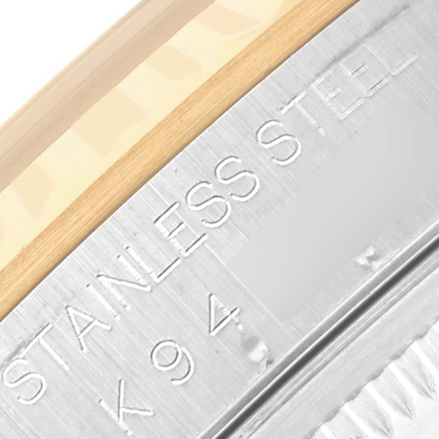 The image shows a close-up angle of the Rolex Datejust 16233 Men's Steel and Gold (two tone) Blue Dial 16233 Men's Steel and Gold (two tone) Blue Dial model, focusing on the engraved "STAINLESS STEEL" marking on the case.