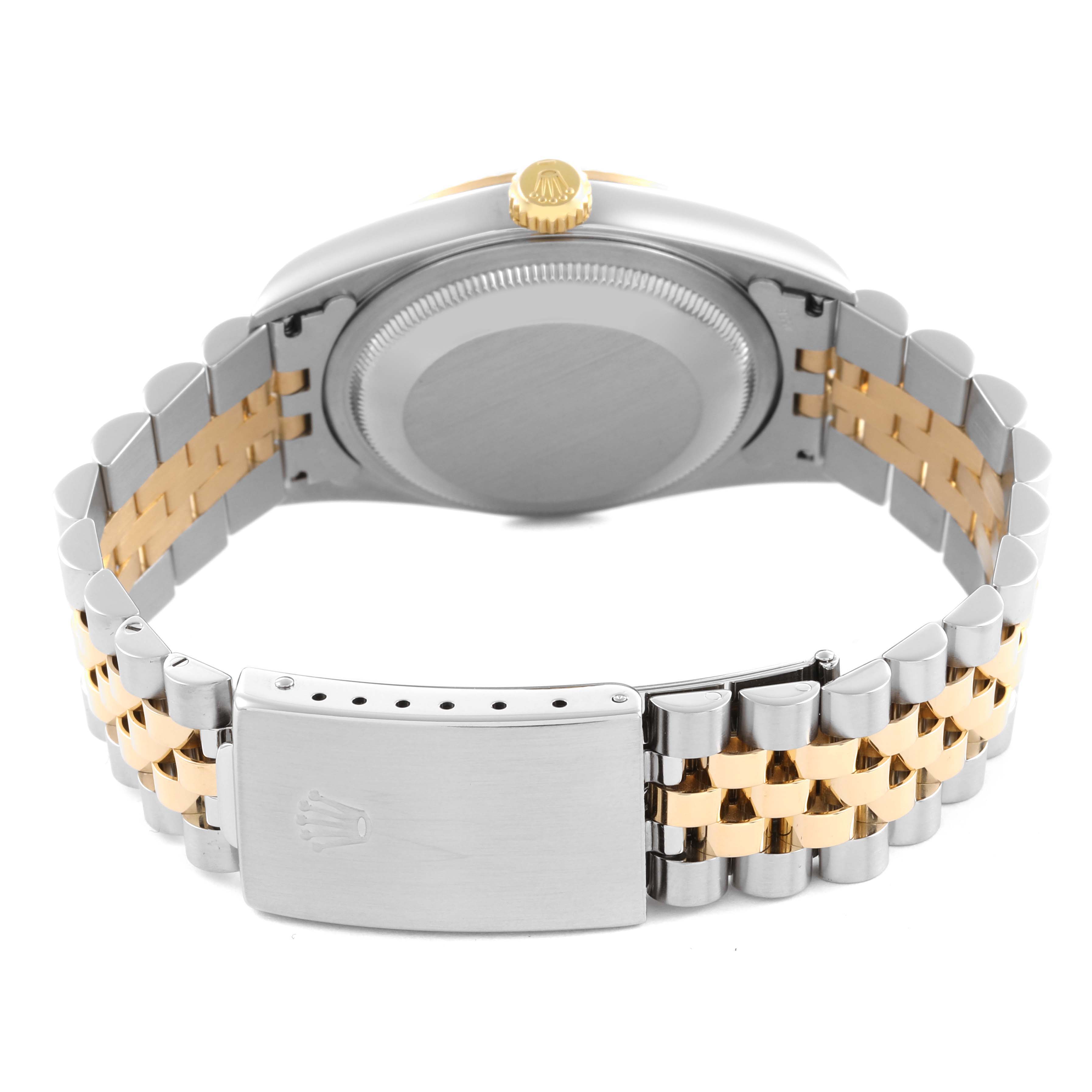 The image shows a Rolex Datejust 16233 Men's Steel and Gold (two tone) Blue Dial 16233 Men's Steel and Gold (two tone) Blue Dial from the back, highlighting the case, crown, and two-tone bracelet.