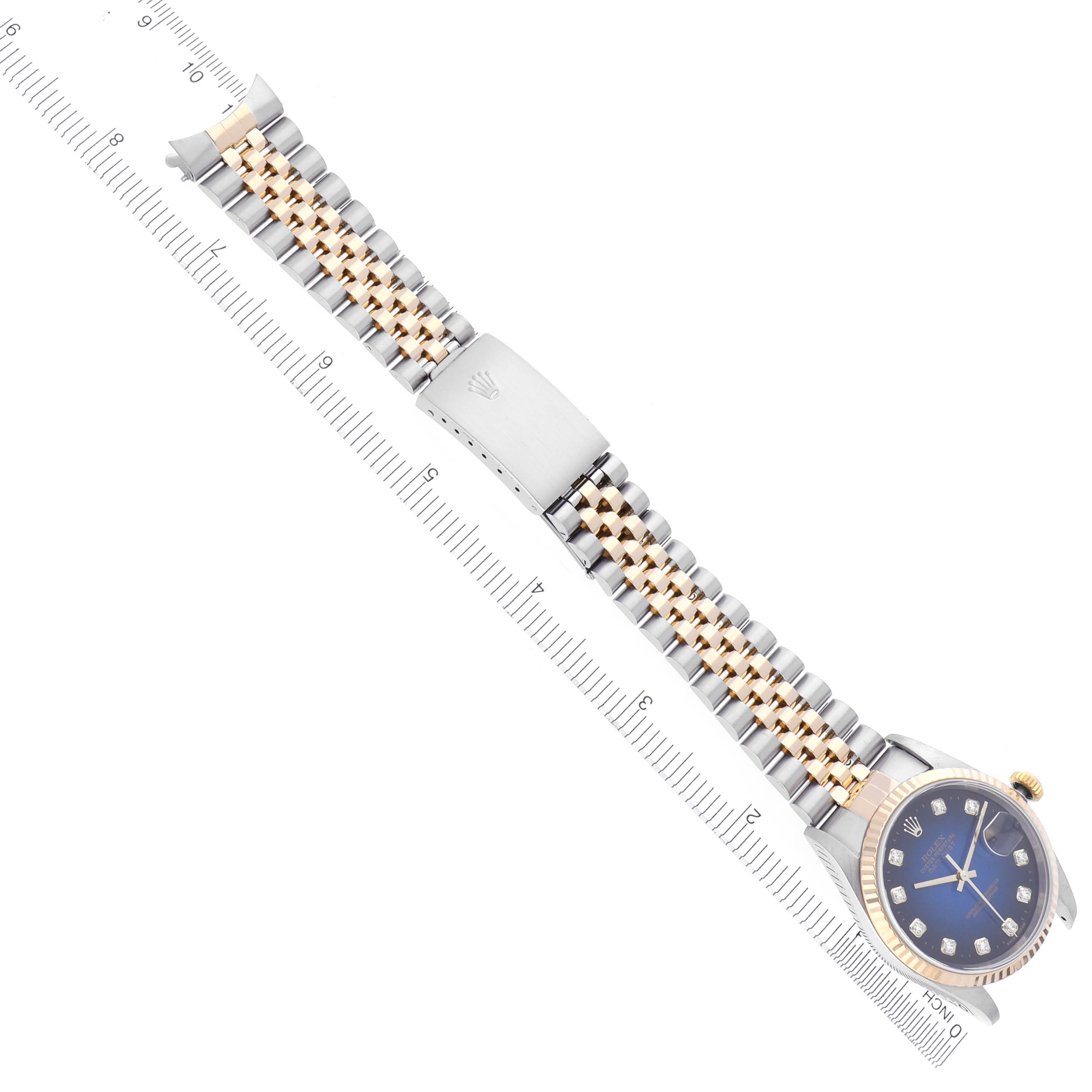 The Rolex Datejust 16233 Men's Steel and Gold (two tone) Blue Dial 16233 Men's Steel and Gold (two tone) Blue Dial watch is shown from an overhead angle, displaying the dial, case, and metal bracelet.