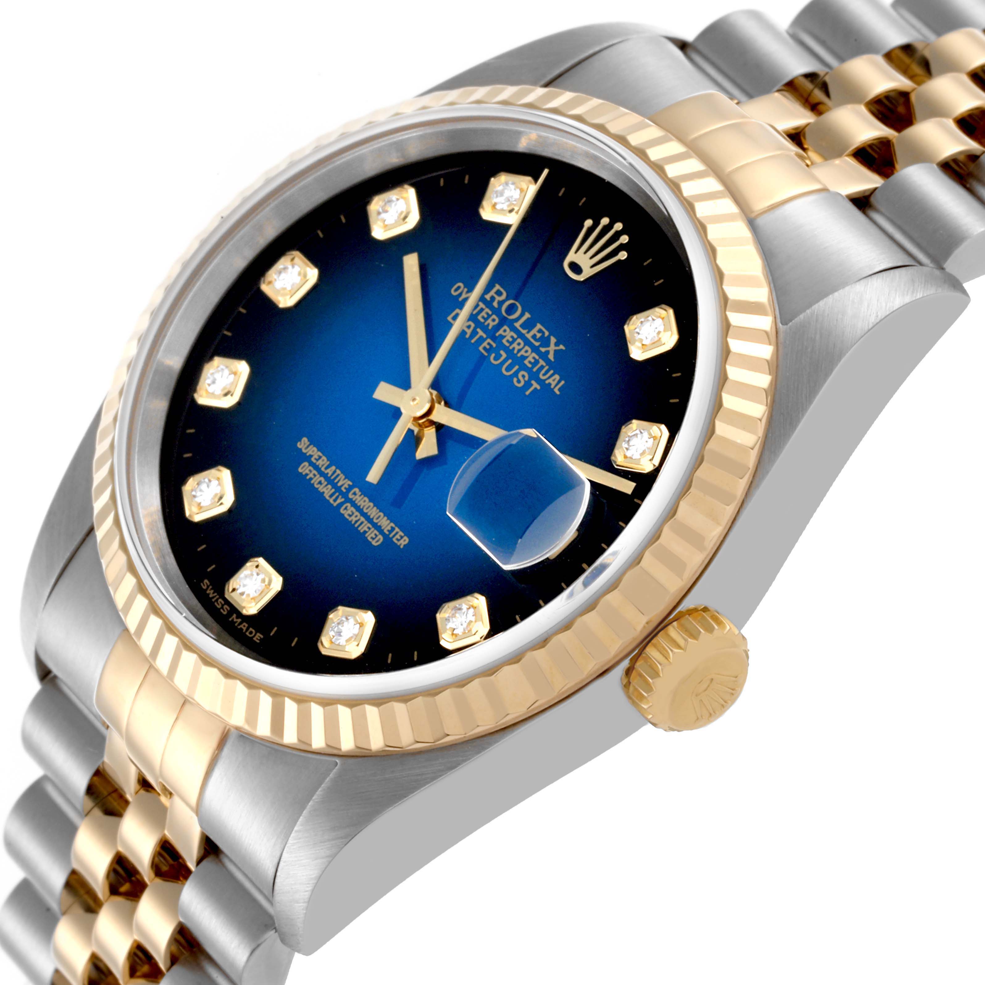 The Rolex Datejust 16233 Men's Steel and Gold (two tone) Blue Dial 16233 Men's Steel and Gold (two tone) Blue Dial watch is shown at an angle highlighting the case, bezel, crown, and part of the bracelet.
