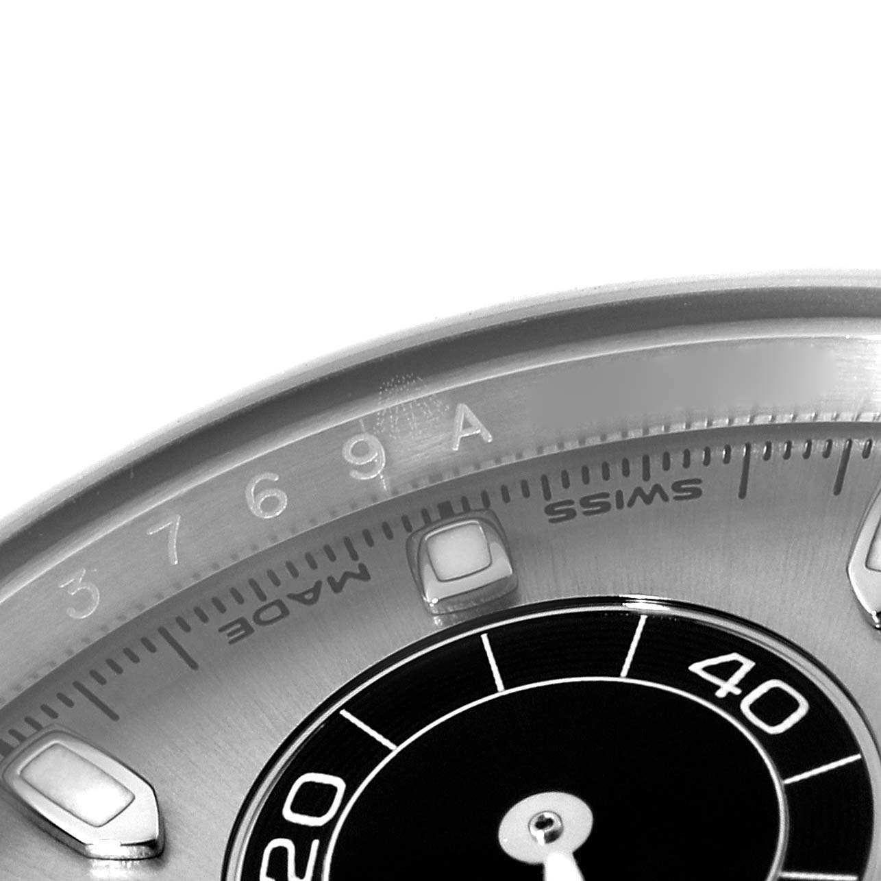 This image shows a close-up angle of the dial and bezel of a Rolex Daytona 116519 Men's White Gold Grey Dial 116519 Men's White Gold Grey Dial watch, highlighting the markers and engravings.