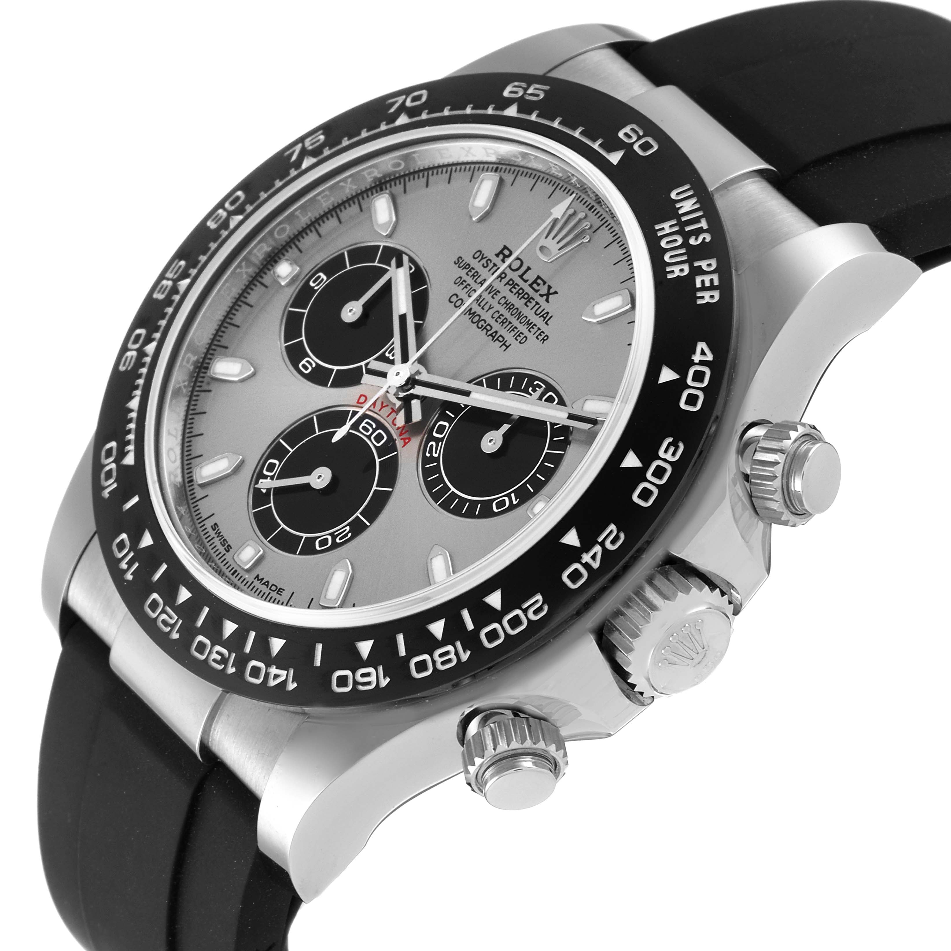 The image shows a Rolex Daytona 116519 Men's White Gold Grey Dial 116519 Men's White Gold Grey Dial watch from a side angle, highlighting its dial, bezel, pushers, and crown with a black strap.