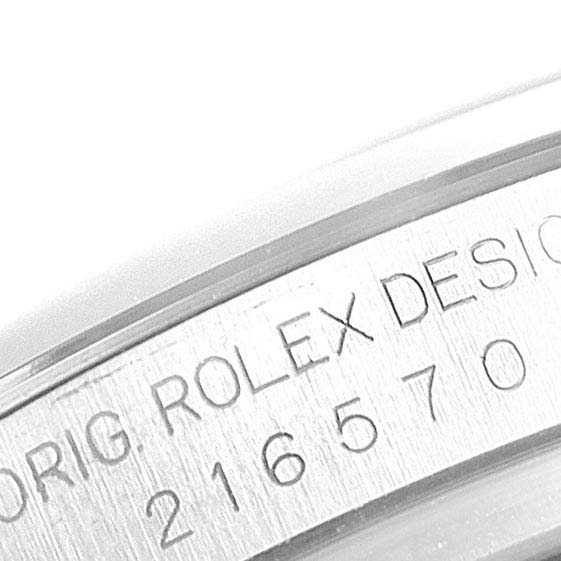 This close-up image shows the engraved serial number and design details on the side of a Rolex Explorer 216570 Men
s Stainless Steel White Dial 216570 Men
s Stainless Steel White Dial watch case.