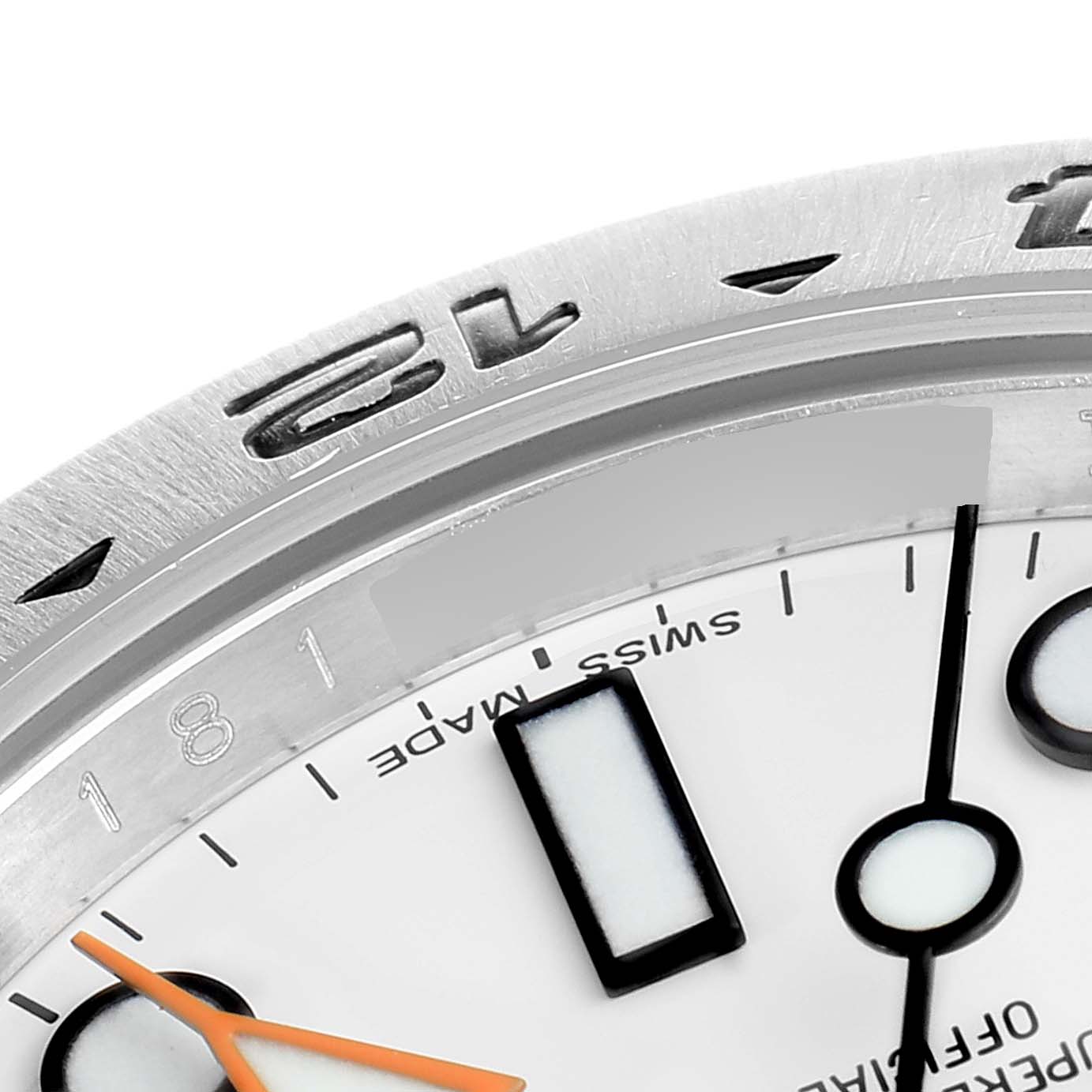 The image shows a close-up angle of the dial and bezel of the Rolex Explorer 216570 Men
s Stainless Steel White Dial 216570 Men
s Stainless Steel White Dial watch, highlighting the minute markers and hands.