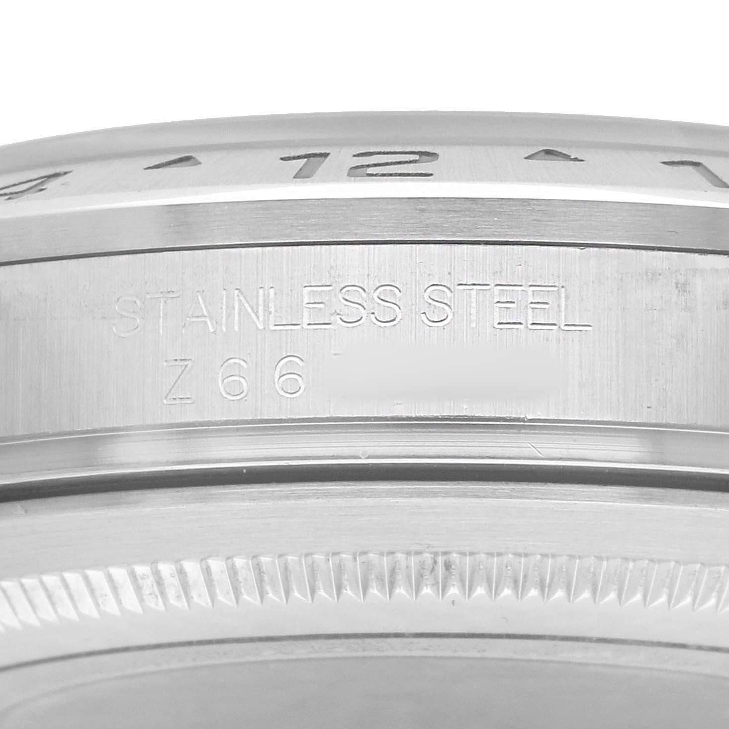 The image shows a close-up of the side of a Rolex Explorer 16570 Men's Stainless Steel White Dial watch, highlighting the stainless steel engraving.