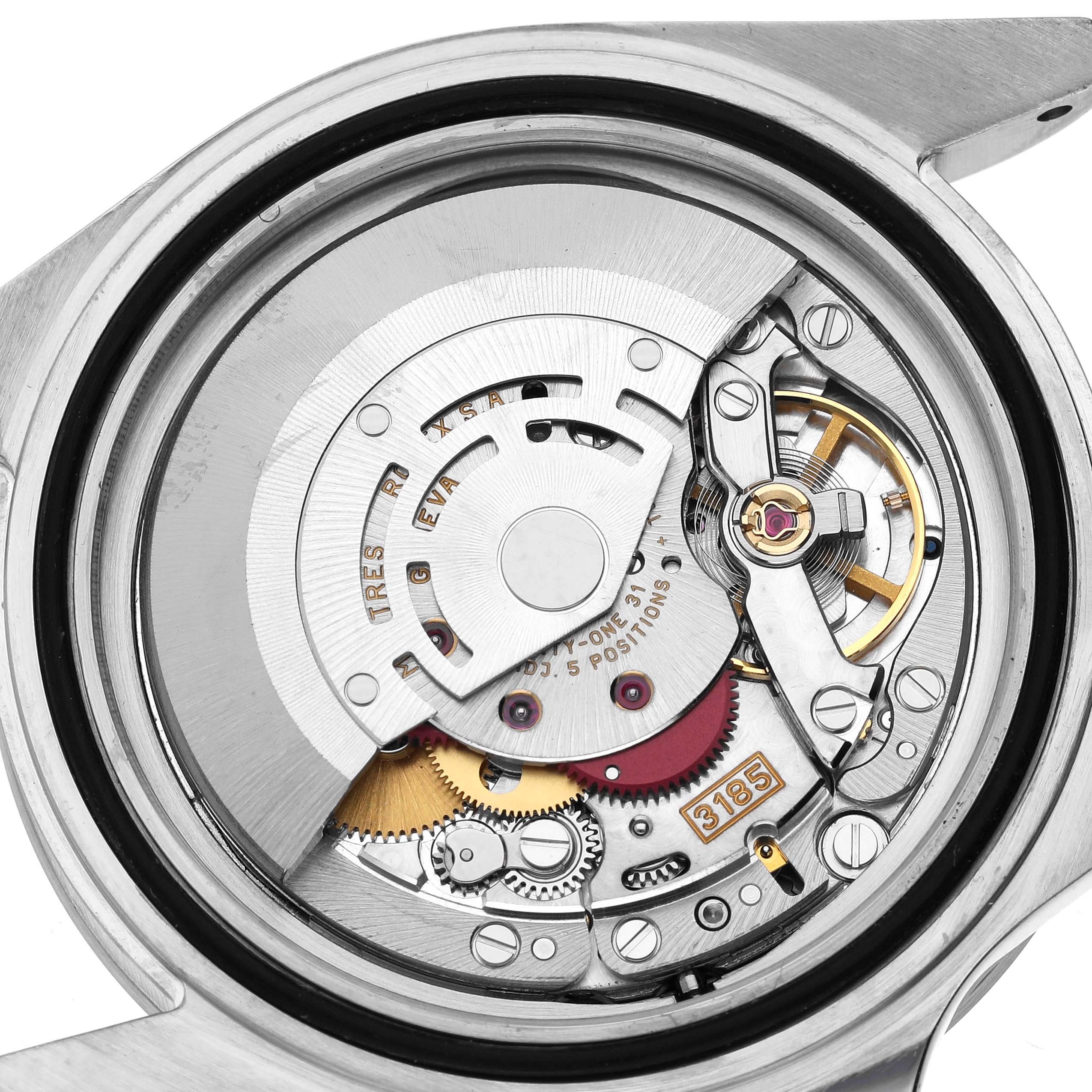 The image shows the movement of a Rolex Explorer 16570 Men's Stainless Steel White Dial watch, viewed from the back, highlighting its internal mechanics.