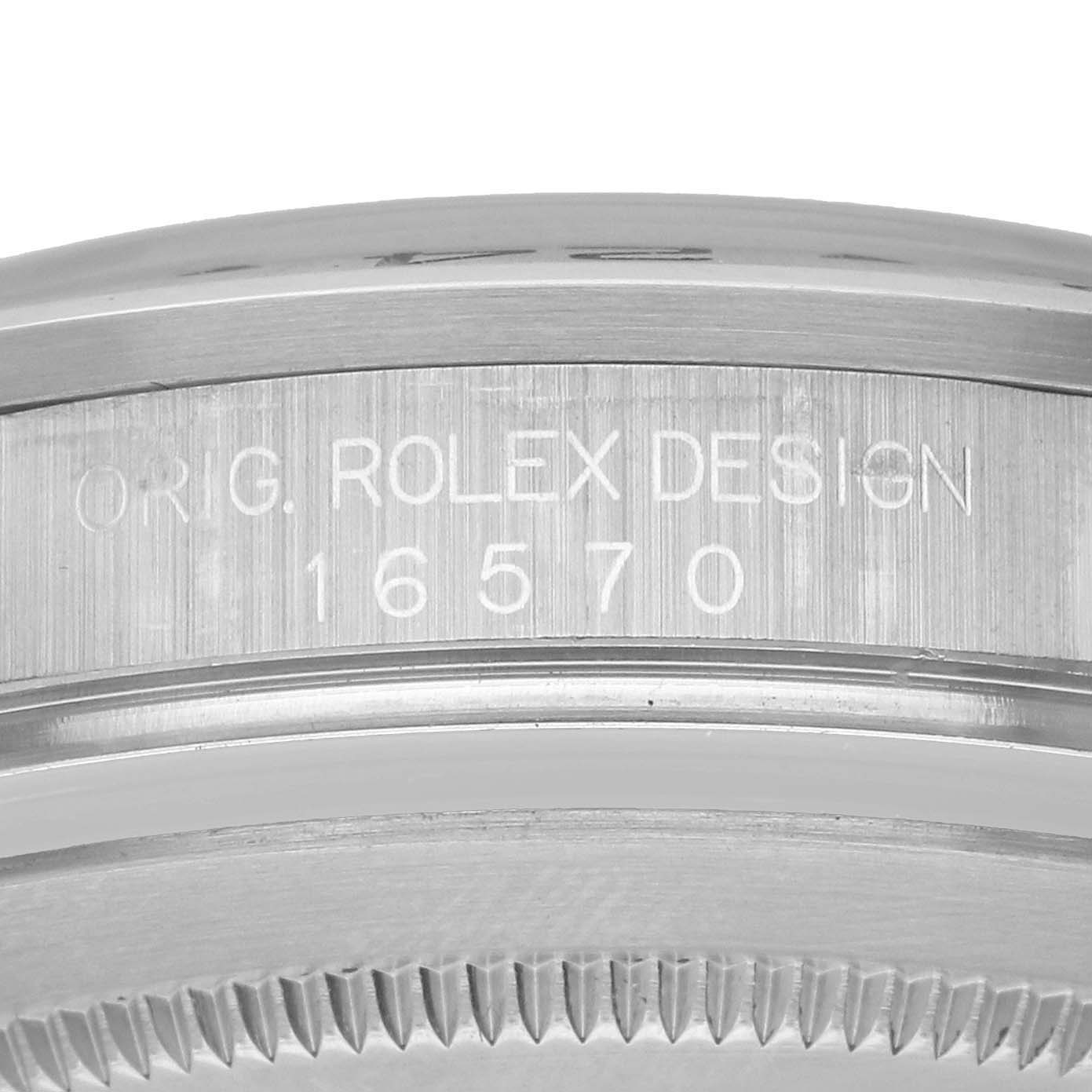 The image shows the side edge of a Rolex Explorer 16570 Men's Stainless Steel White Dial model, highlighting the engraving details on the bezel.