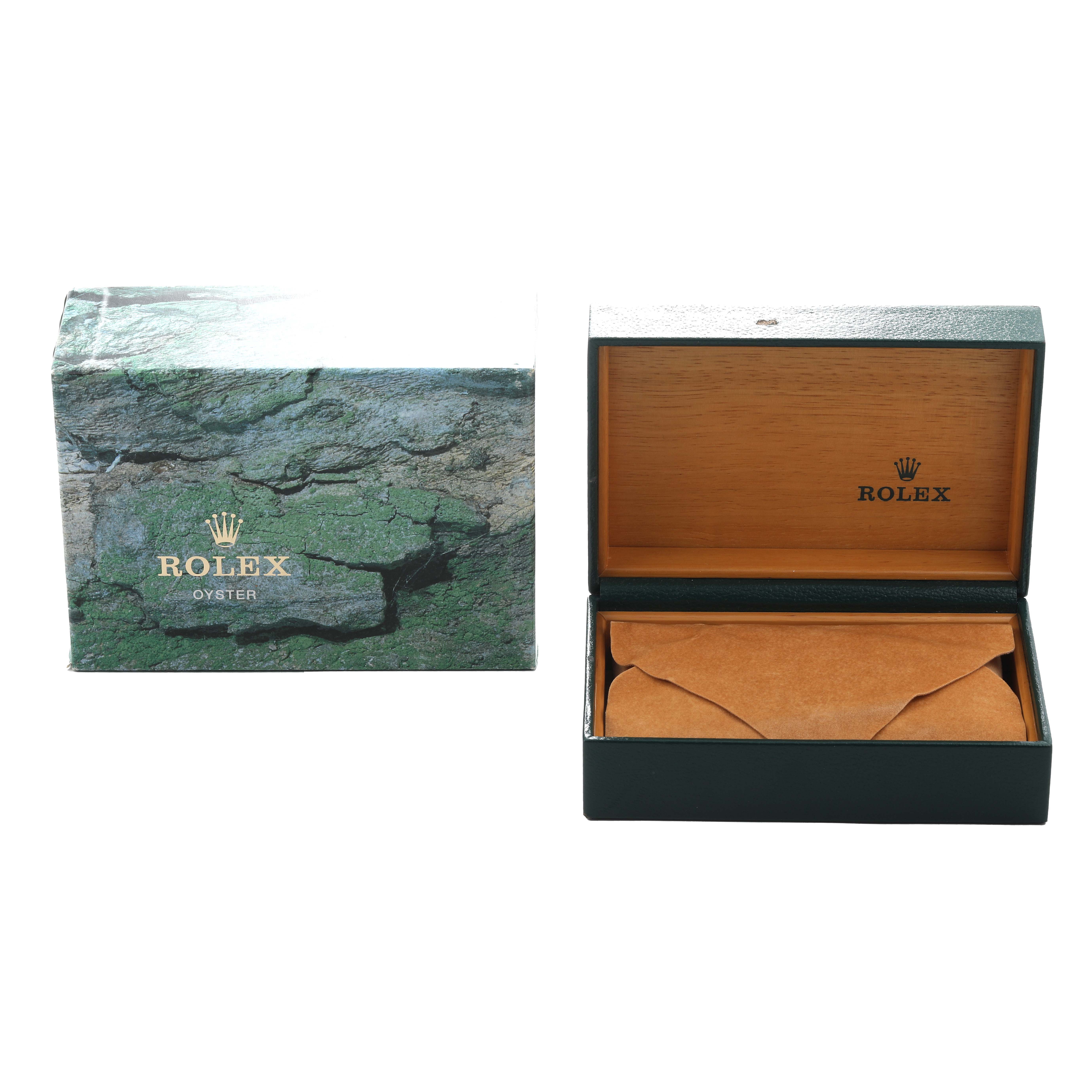 The image shows a Rolex Explorer 16570 Men's Stainless Steel Black Dial watch box and an open case, displaying the brand logo and packaging materials.