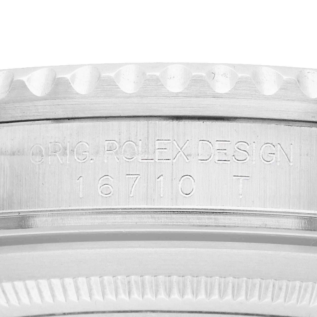 The image shows the side engraving of the Rolex GMT-Master 16710 Men's Stainless Steel Black Dial model 16710, highlighting the case and design details.