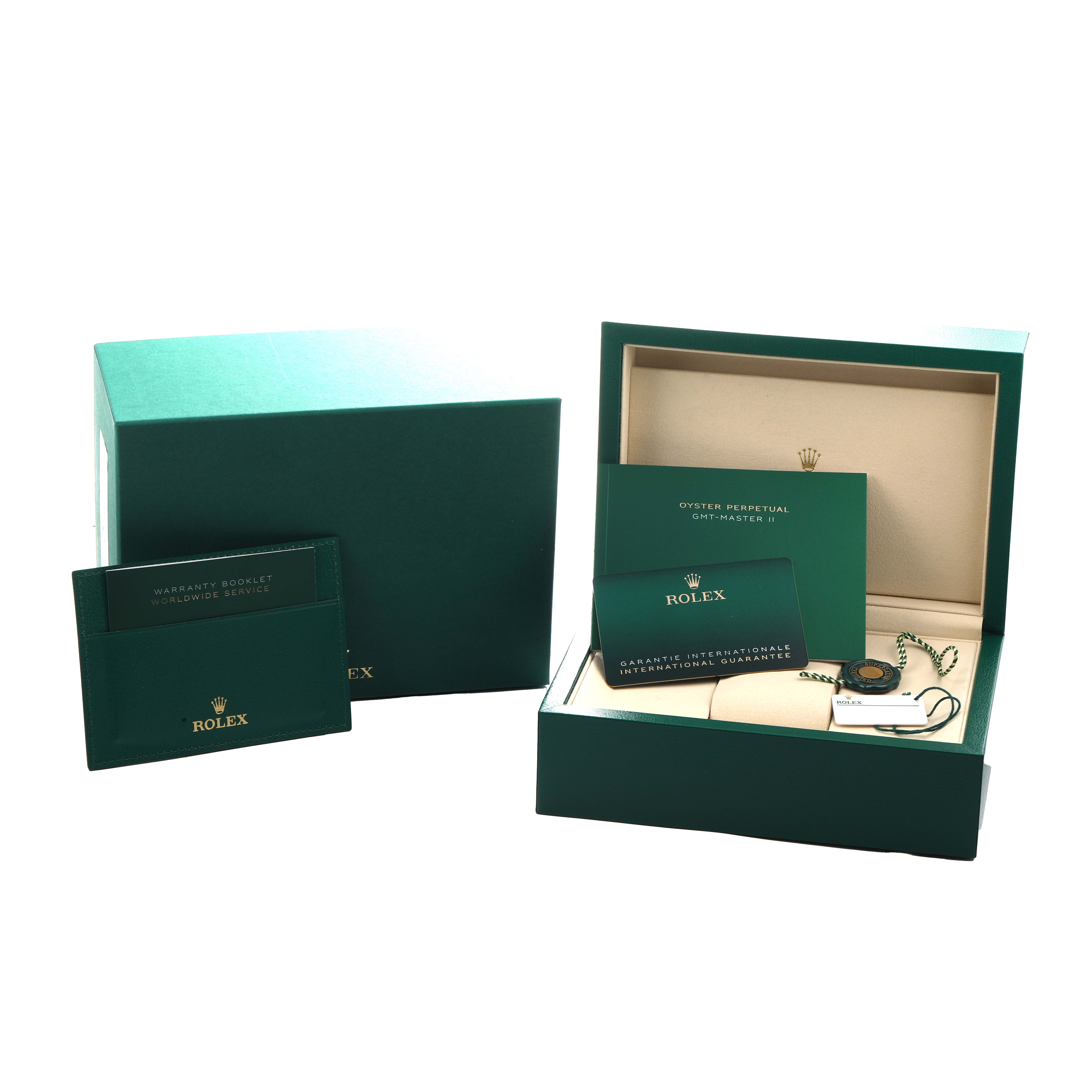 The image shows the packaging, warranty booklets, and accessories for the Rolex GMT-Master 126710 Men's Stainless Steel Black Dial model.